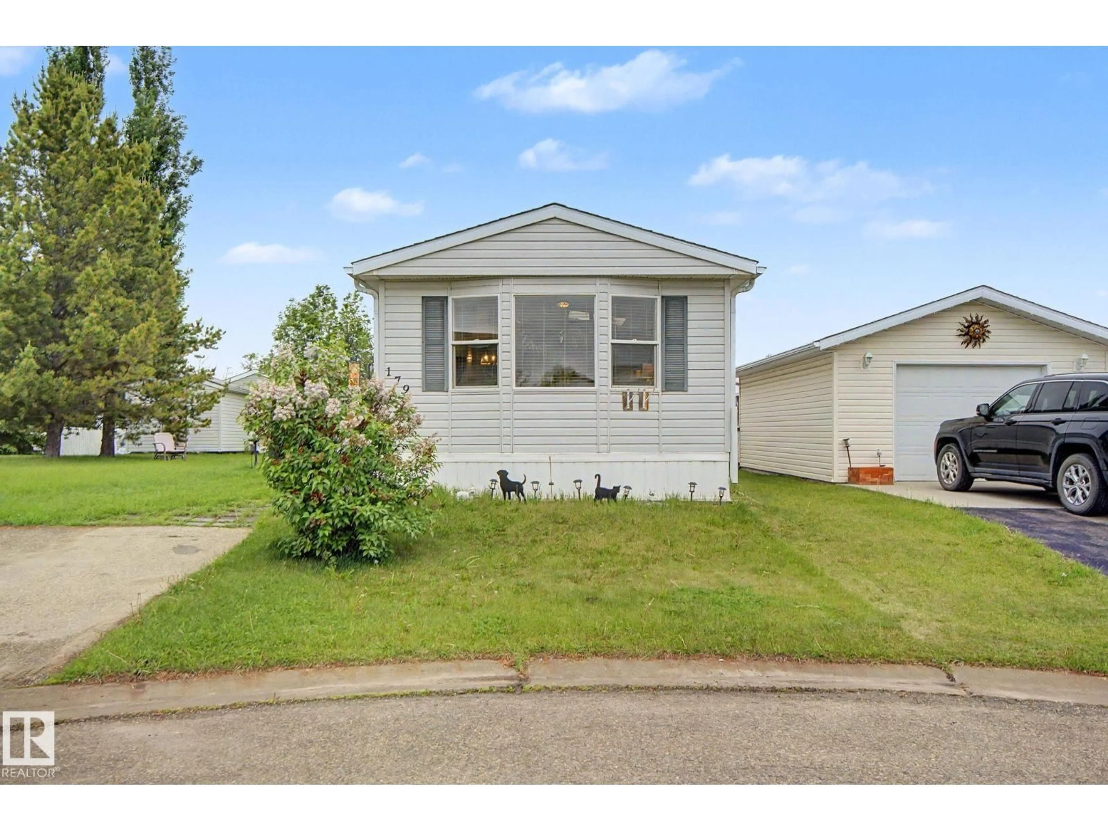 Home with vinyl exterior material, street for 3400 48 ST, Stony Plain Alberta T7Z1W2