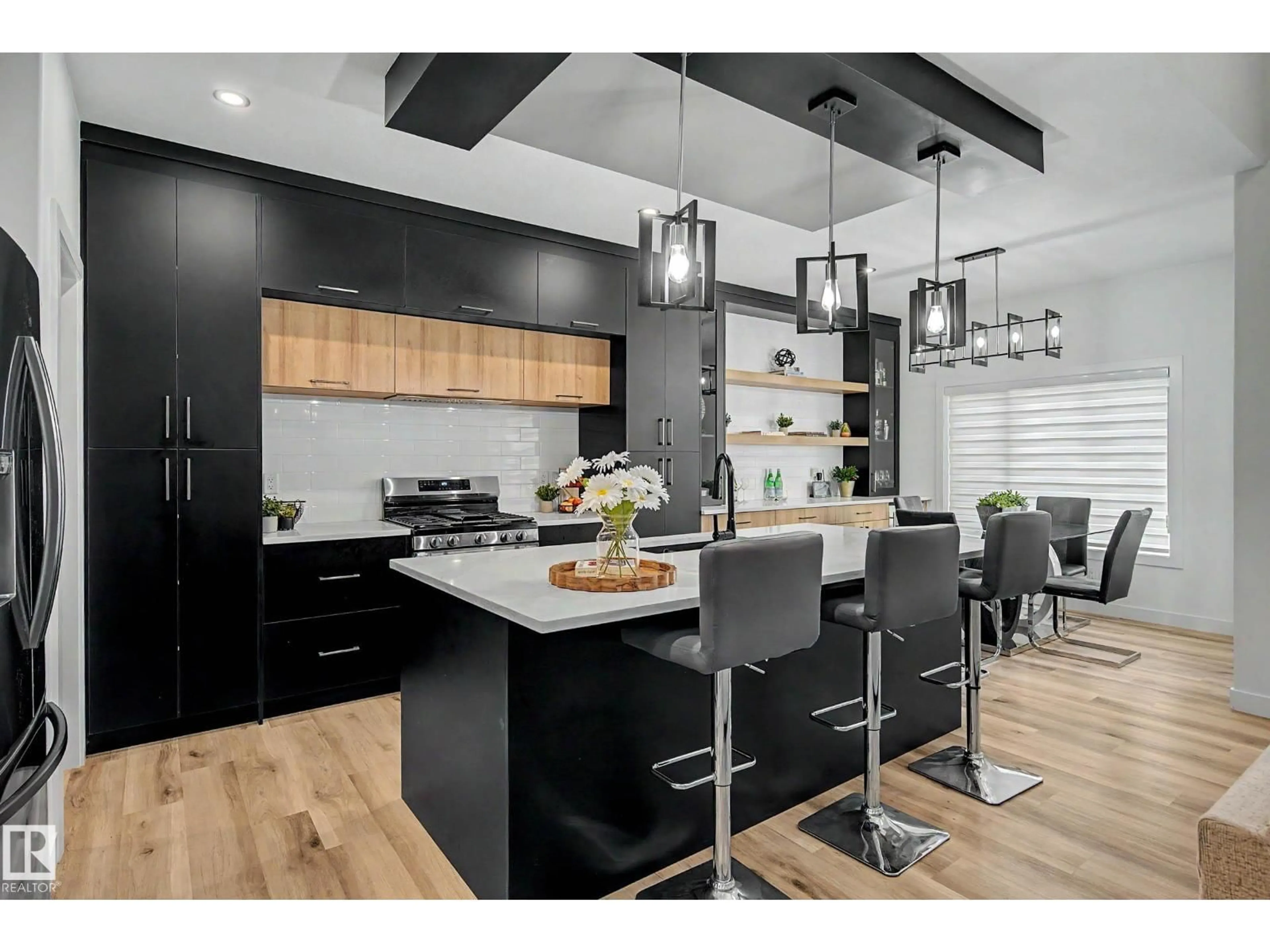 Open concept kitchen, wood/laminate floor for NW - 1368 SISKIN WD, Edmonton Alberta T5S0R3