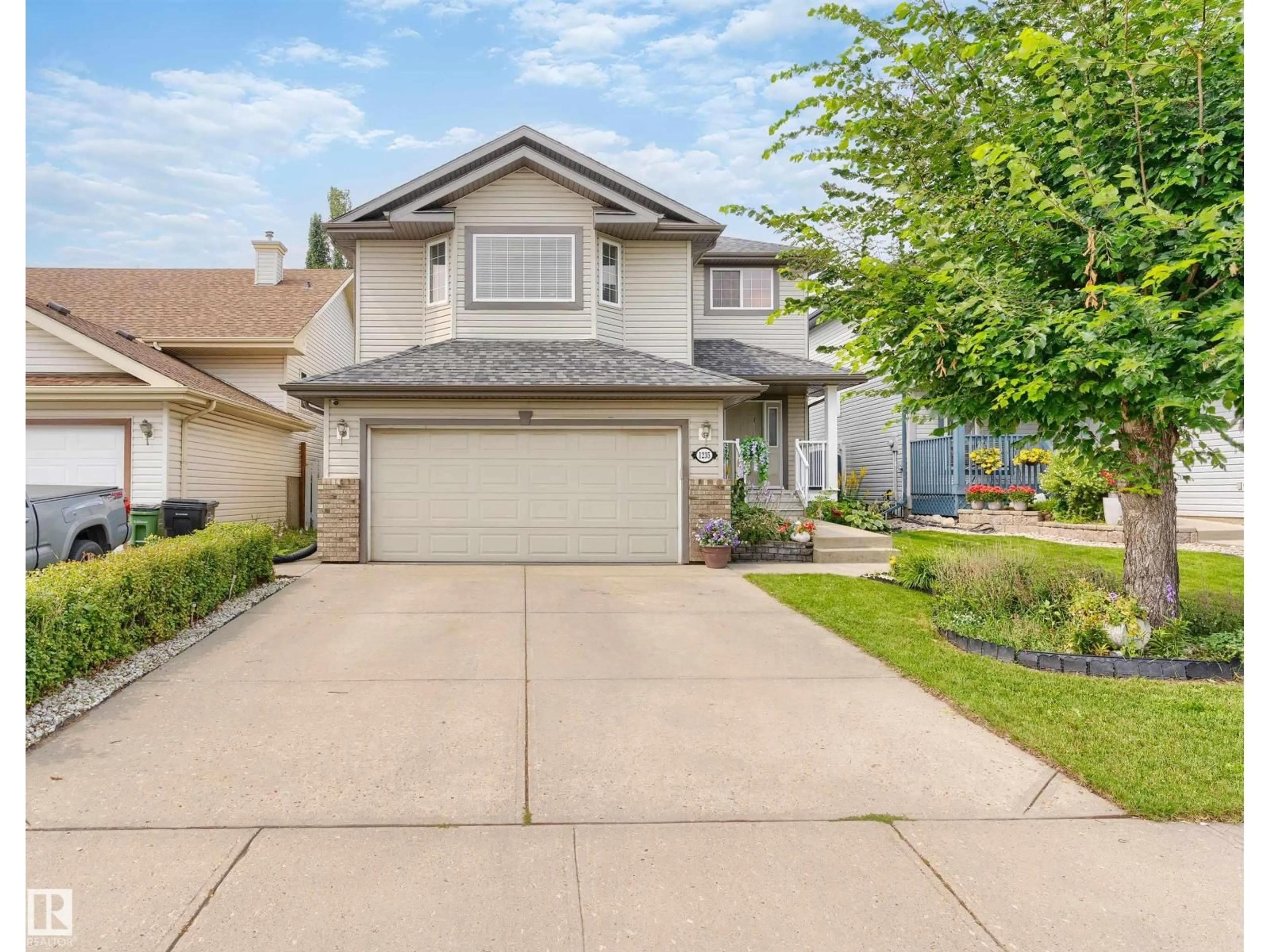 Home with vinyl exterior material, street for 1235 ORMSBY LN, Edmonton Alberta T5T6R2
