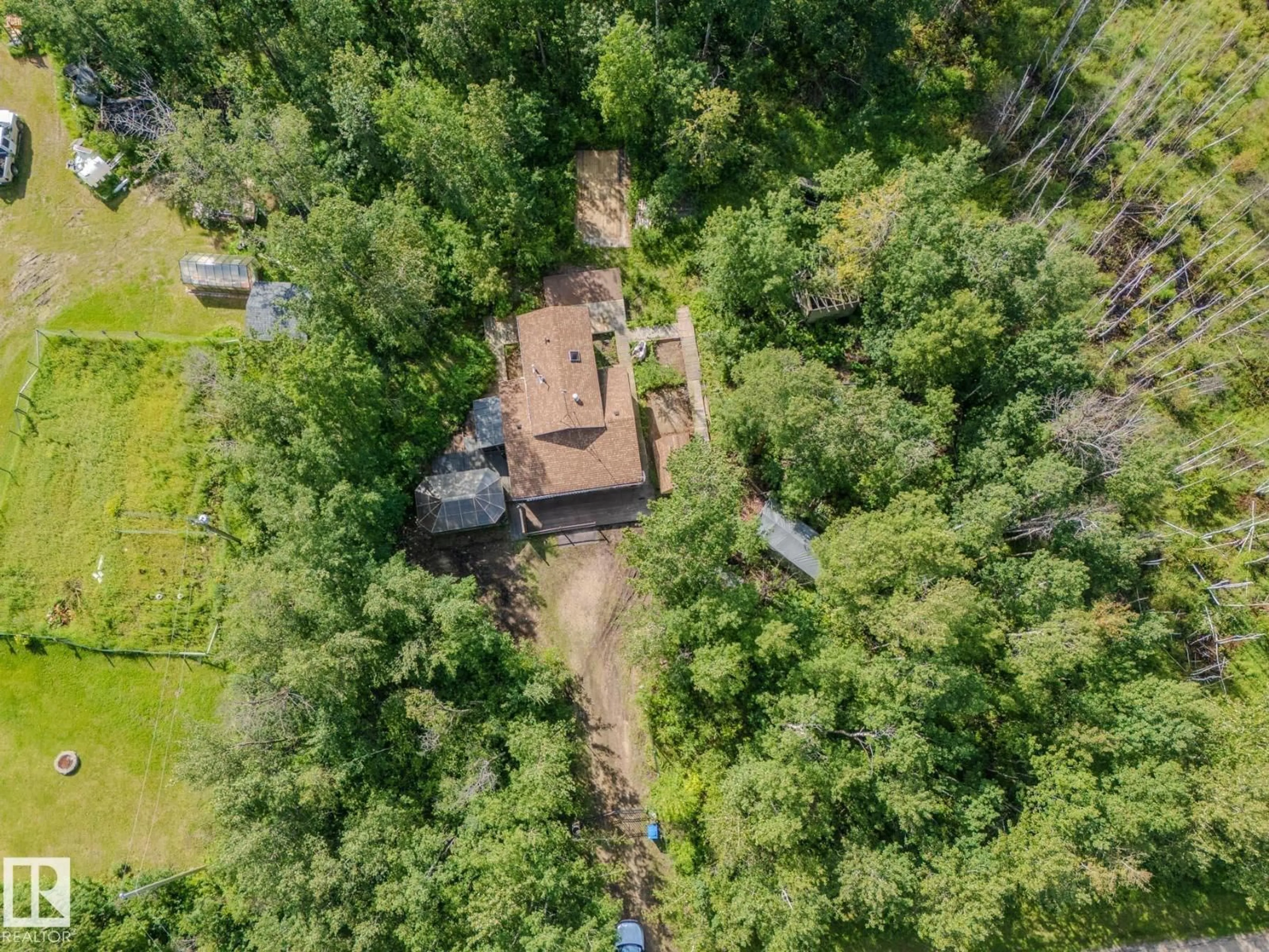 A pic from outside/outdoor area/front of a property/back of a property/a pic from drone, forest/trees view for 146 53051 RGE ROAD 211, Rural Strathcona County Alberta T8G2C6