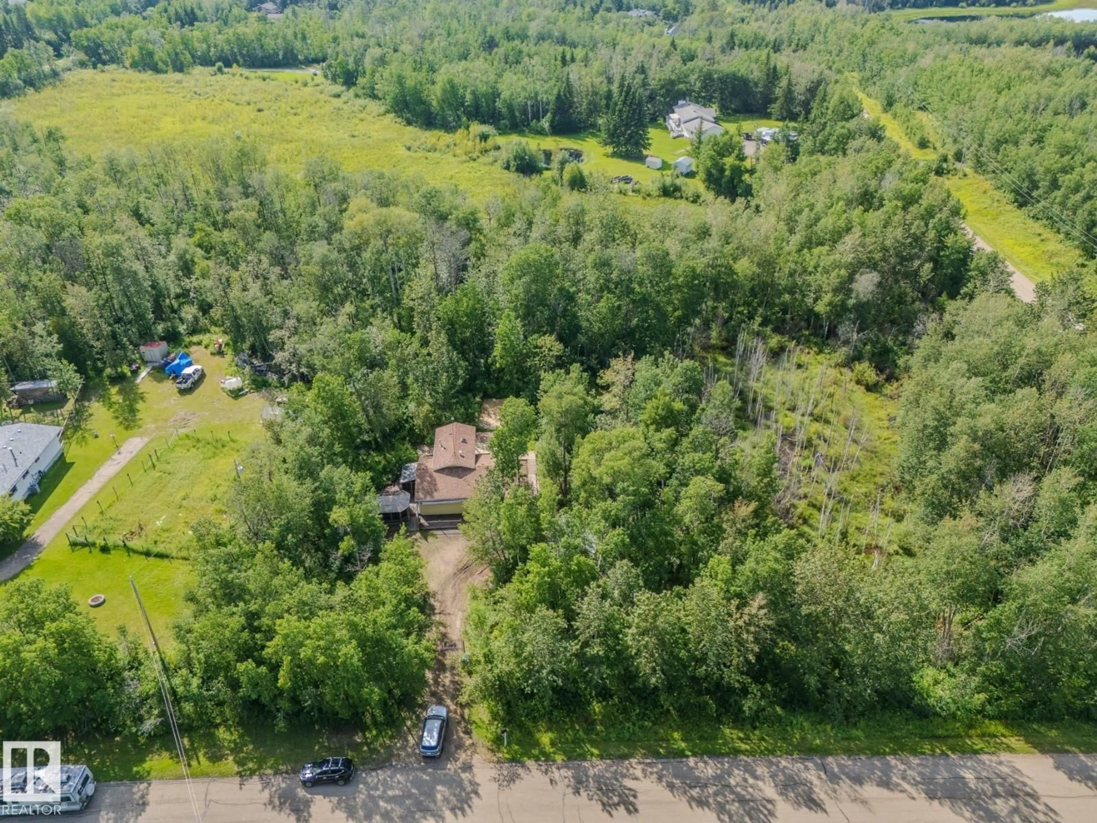 A pic from outside/outdoor area/front of a property/back of a property/a pic from drone, forest/trees view for 146 53051 RGE ROAD 211, Rural Strathcona County Alberta T8G2C6