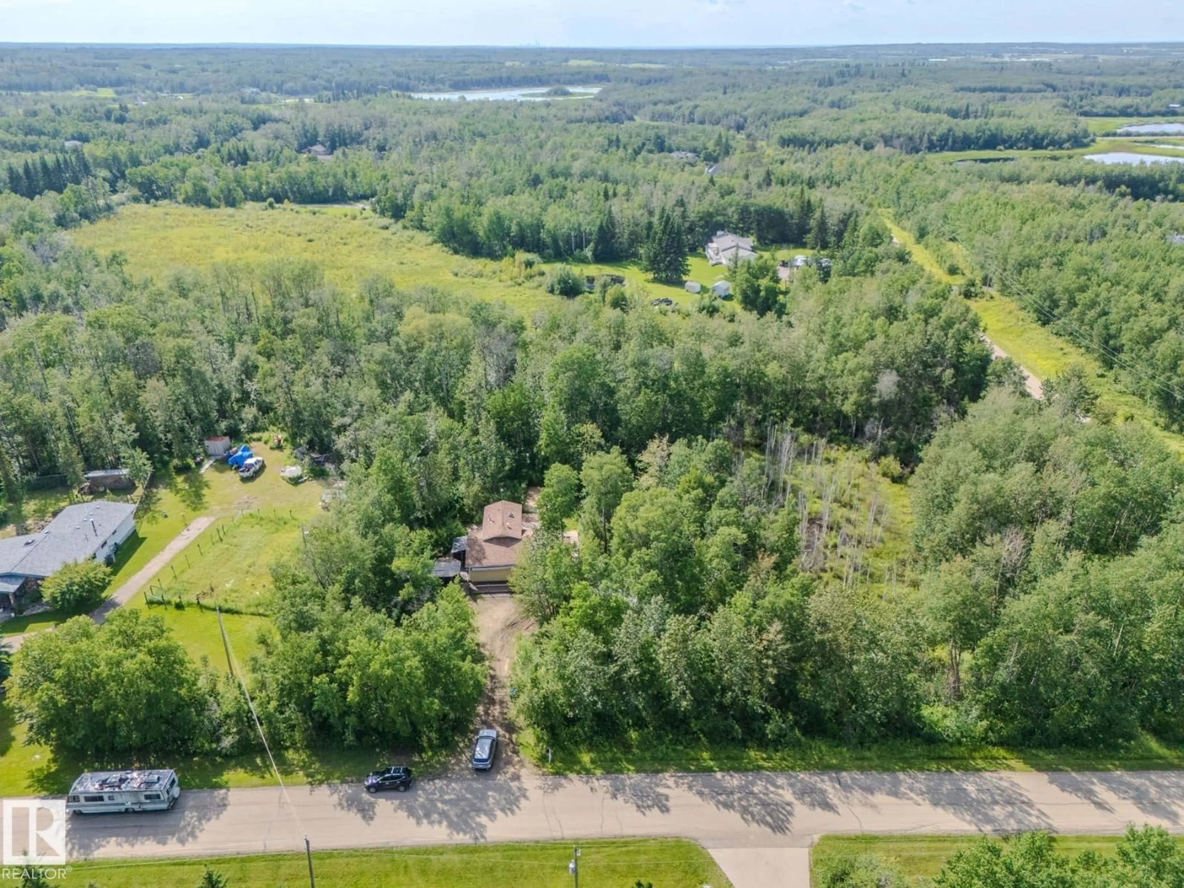 A pic from outside/outdoor area/front of a property/back of a property/a pic from drone, forest/trees view for 146 53051 RGE ROAD 211, Rural Strathcona County Alberta T8G2C6