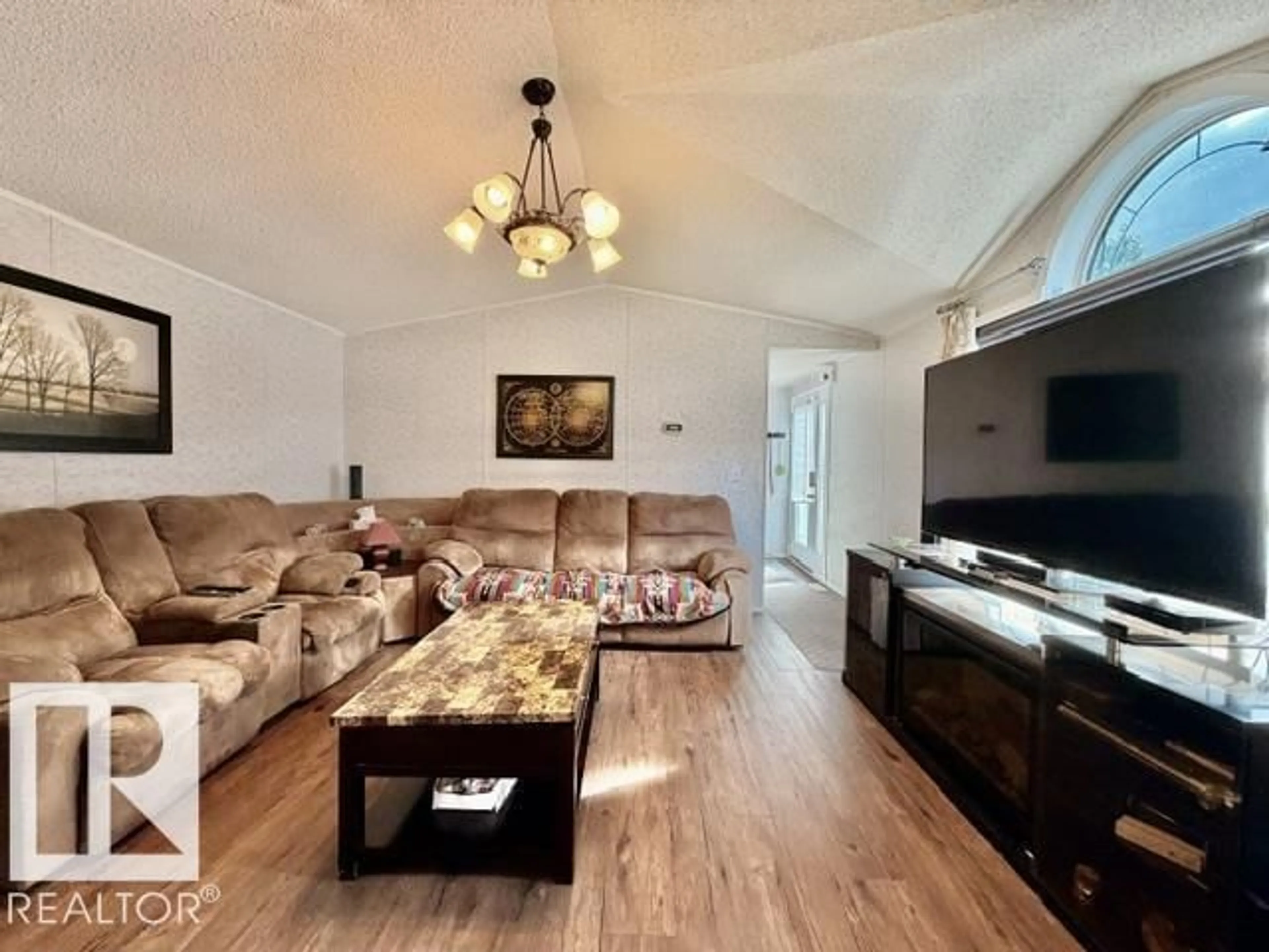 Living room with furniture, wood/laminate floor for 4814 48 AV, Wetaskiwin Alberta T9A0E7