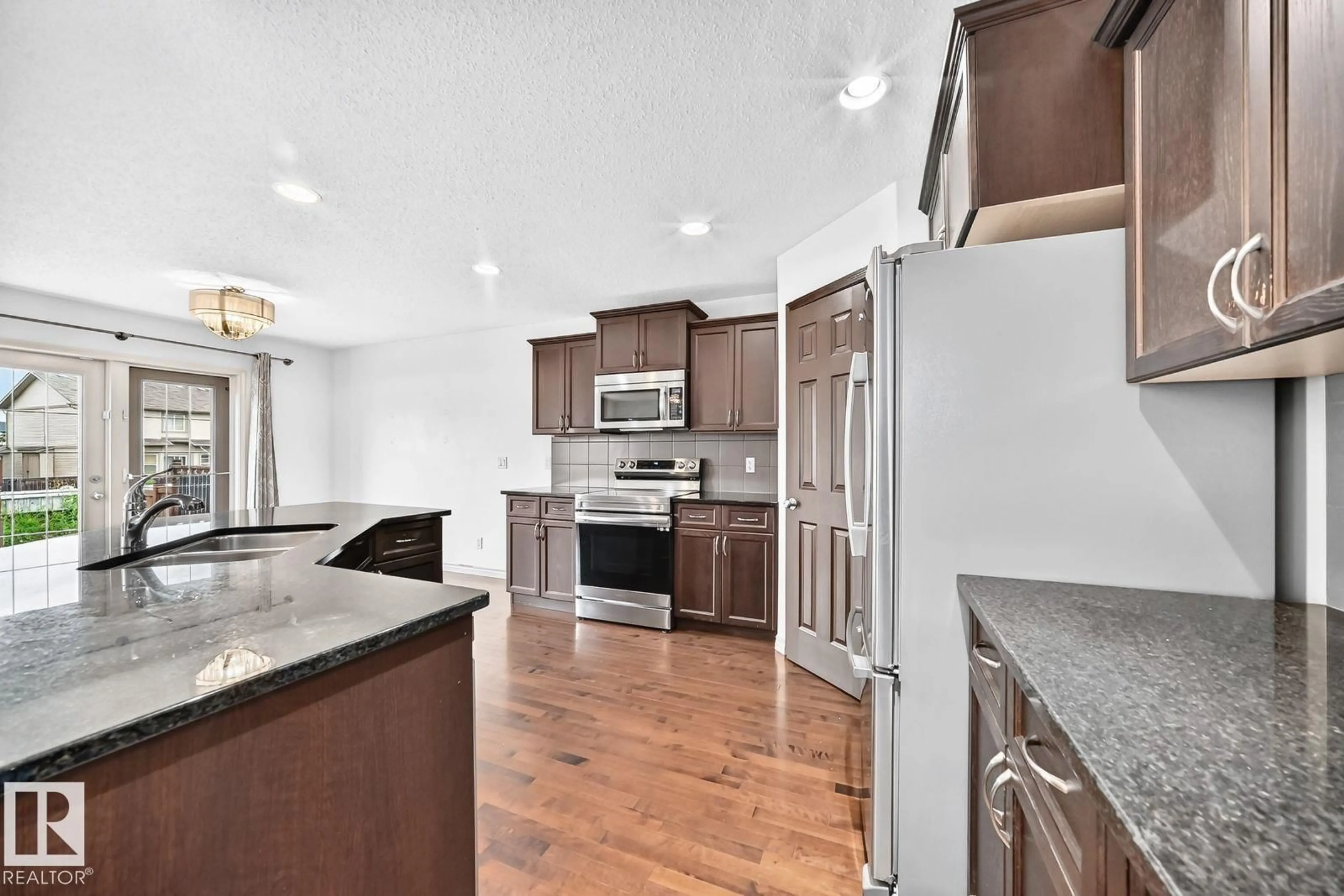 Open concept kitchen, ceramic/tile floor for 217 SILVERSTONE CR, Stony Plain Alberta T7Z0E8