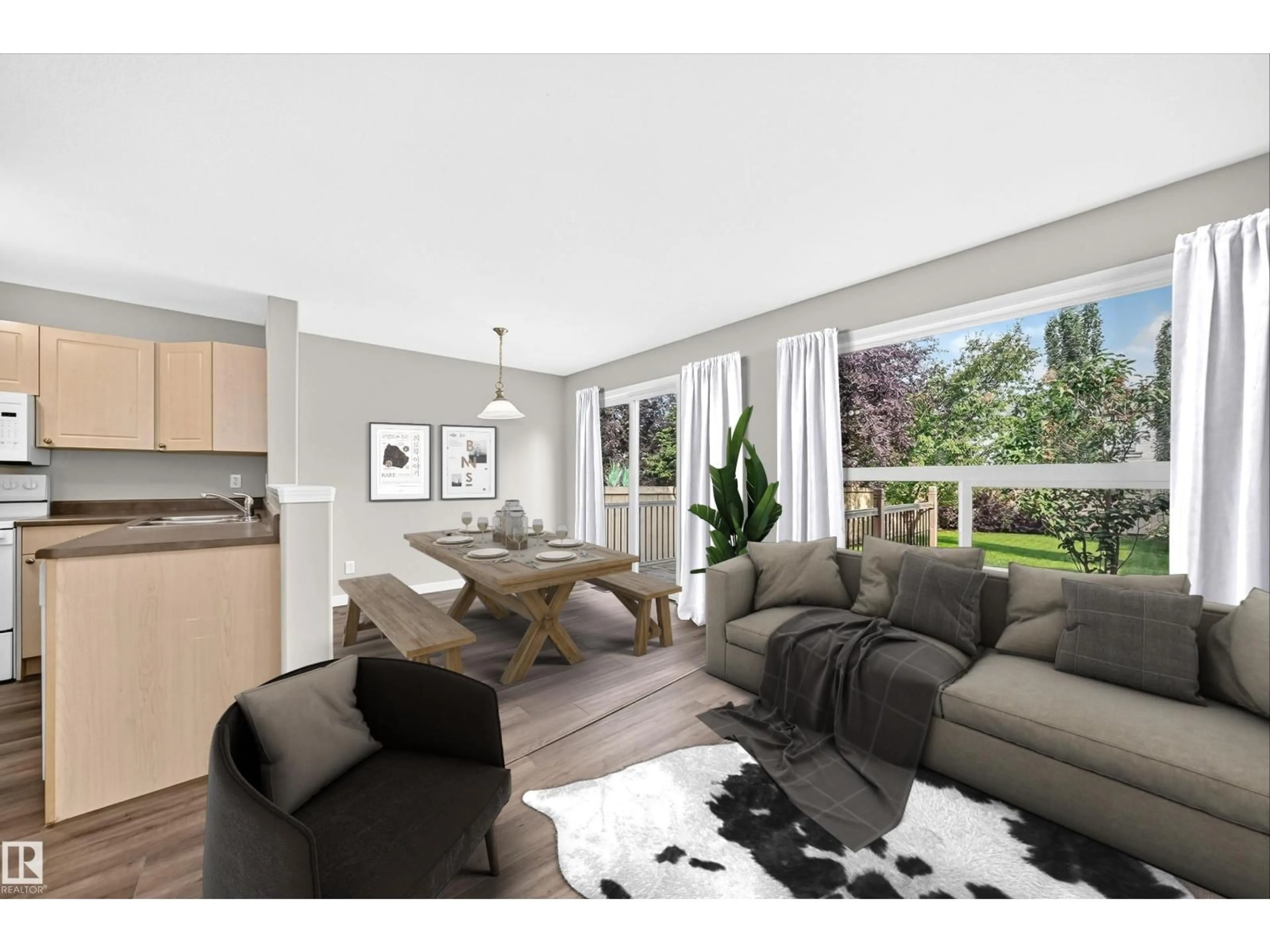 Living room with furniture, wood/laminate floor for 11432 169 AV, Edmonton Alberta T5X6G7