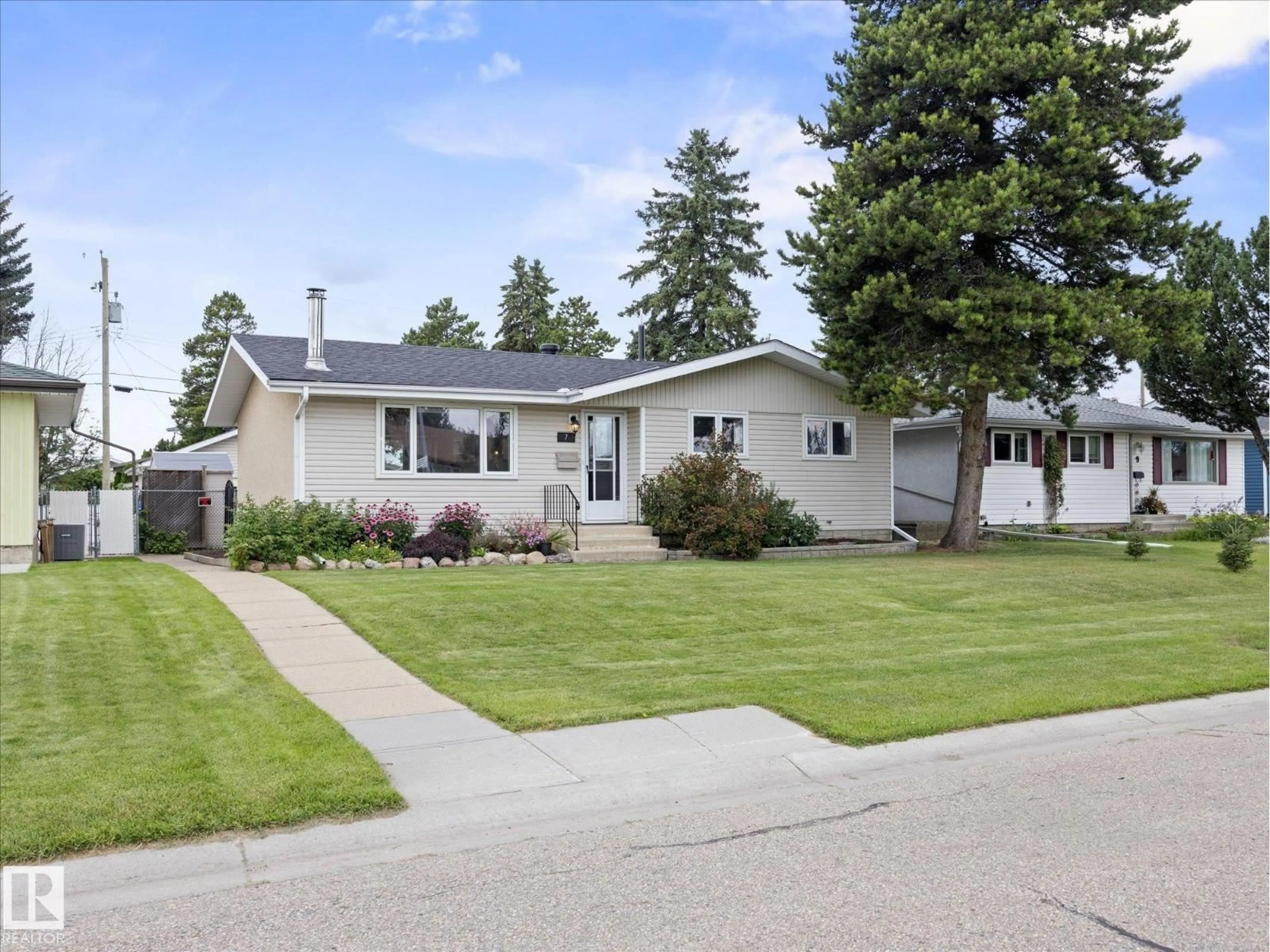 Home with vinyl exterior material, street for 7 CAMELOT AV, Leduc Alberta T9E4M4