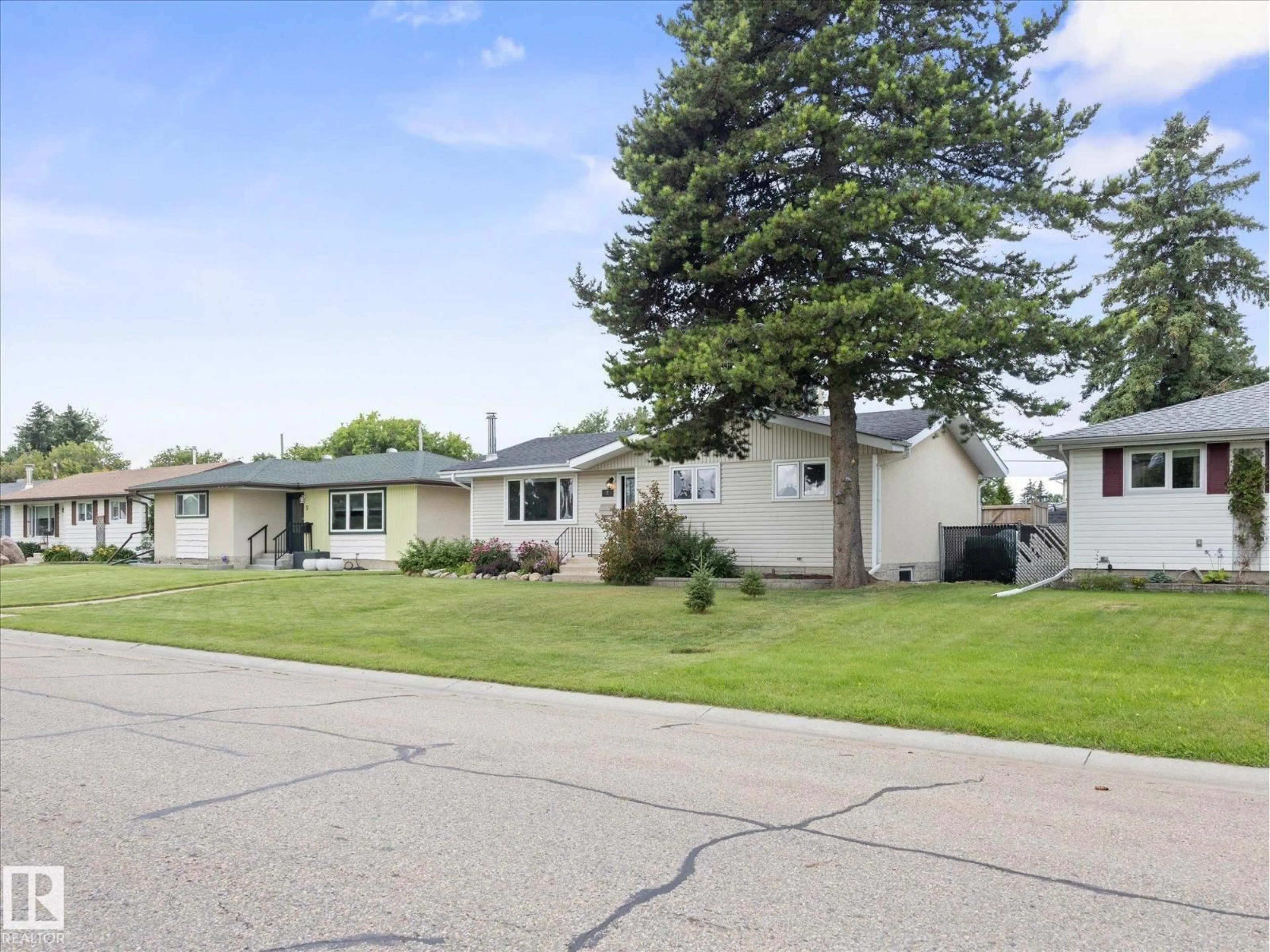 Home with vinyl exterior material, street for 7 CAMELOT AV, Leduc Alberta T9E4M4