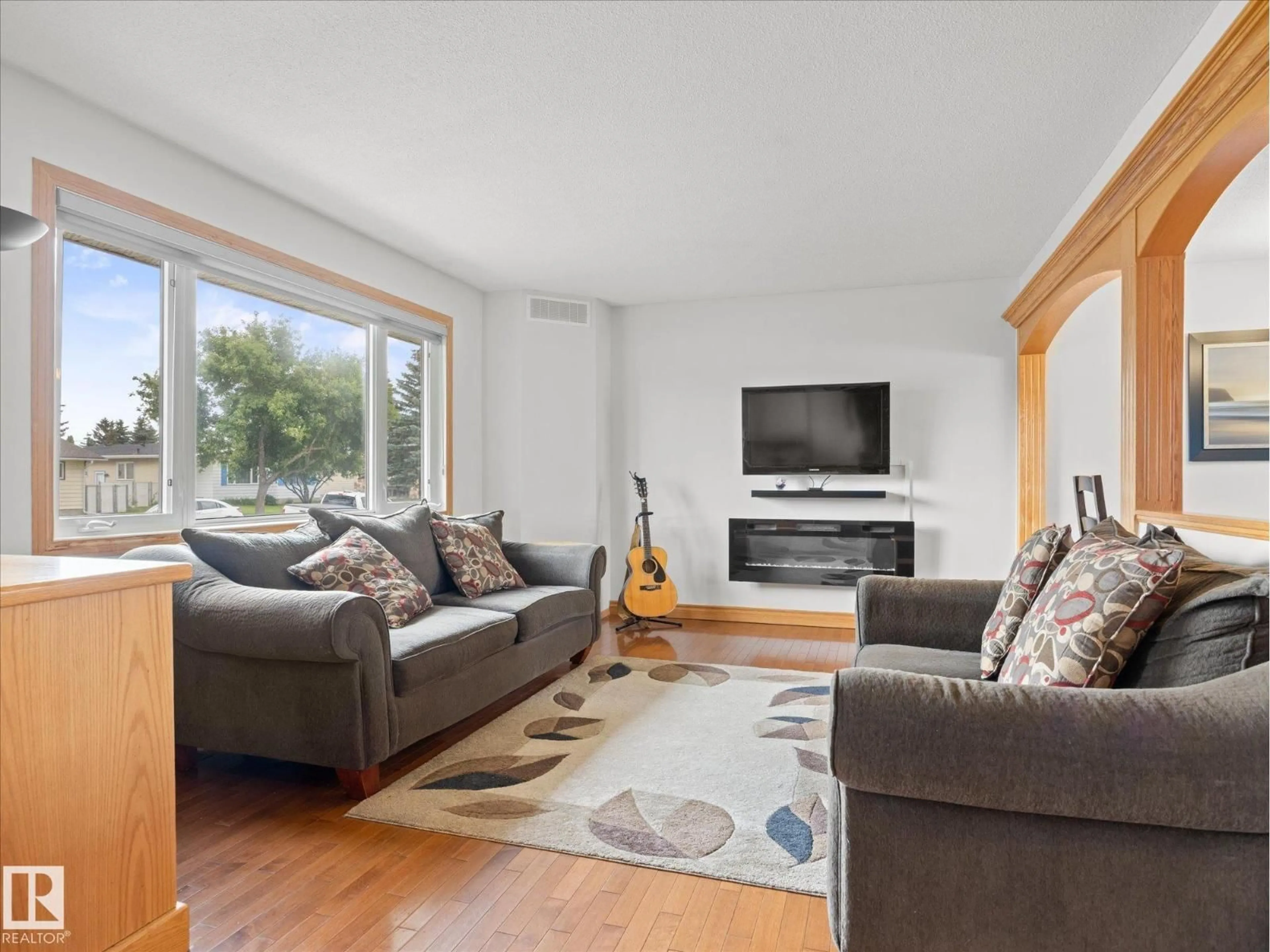 Living room with furniture, wood/laminate floor for 7 CAMELOT AV, Leduc Alberta T9E4M4