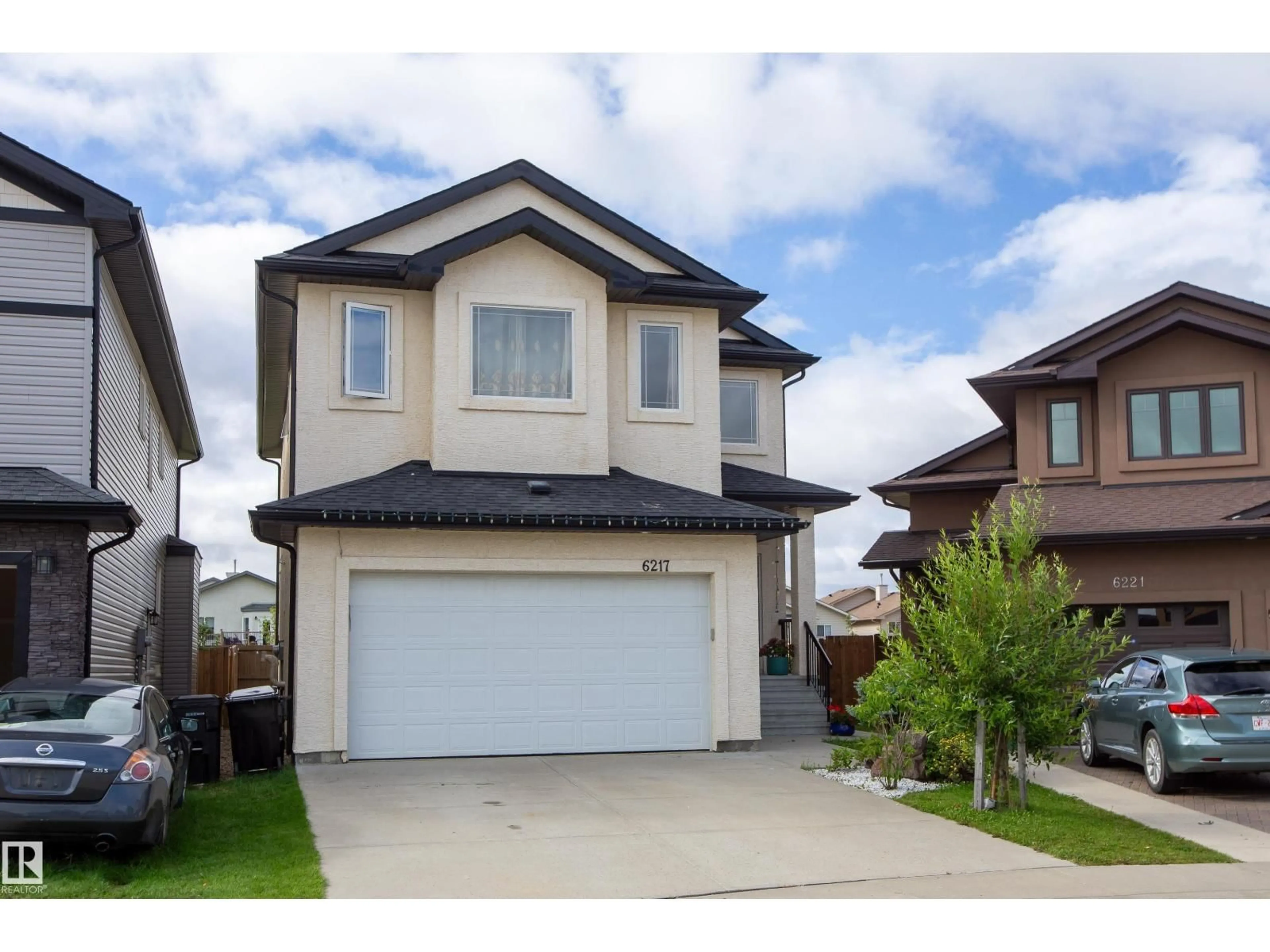 Home with vinyl exterior material, street for 6217 167A AVENUE, Edmonton Alberta T5Y3M8