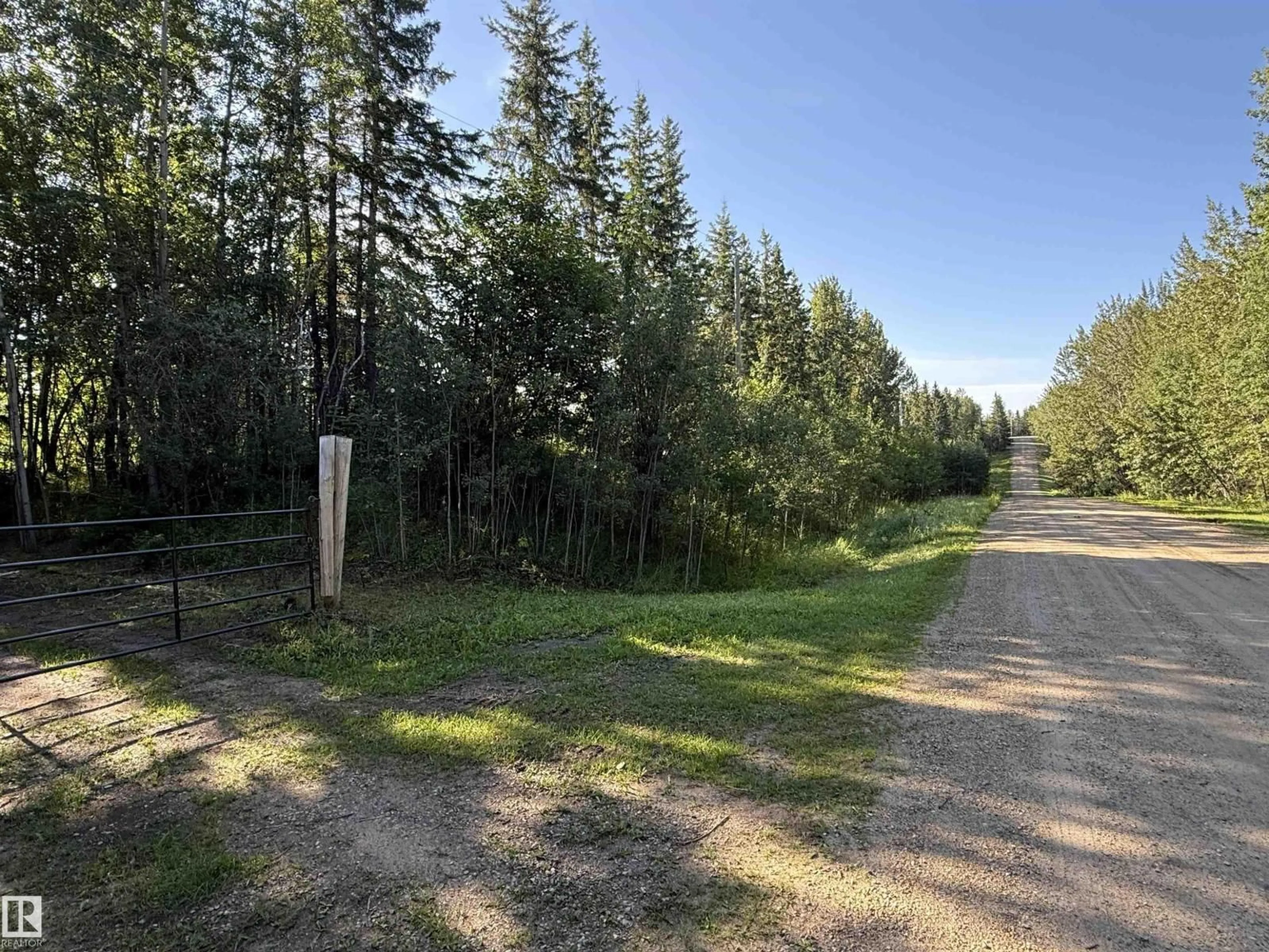 A pic from outside/outdoor area/front of a property/back of a property/a pic from drone, forest/trees view for 7 - 53104 RGE ROAD 13, Rural Parkland County Alberta T7Y2T2