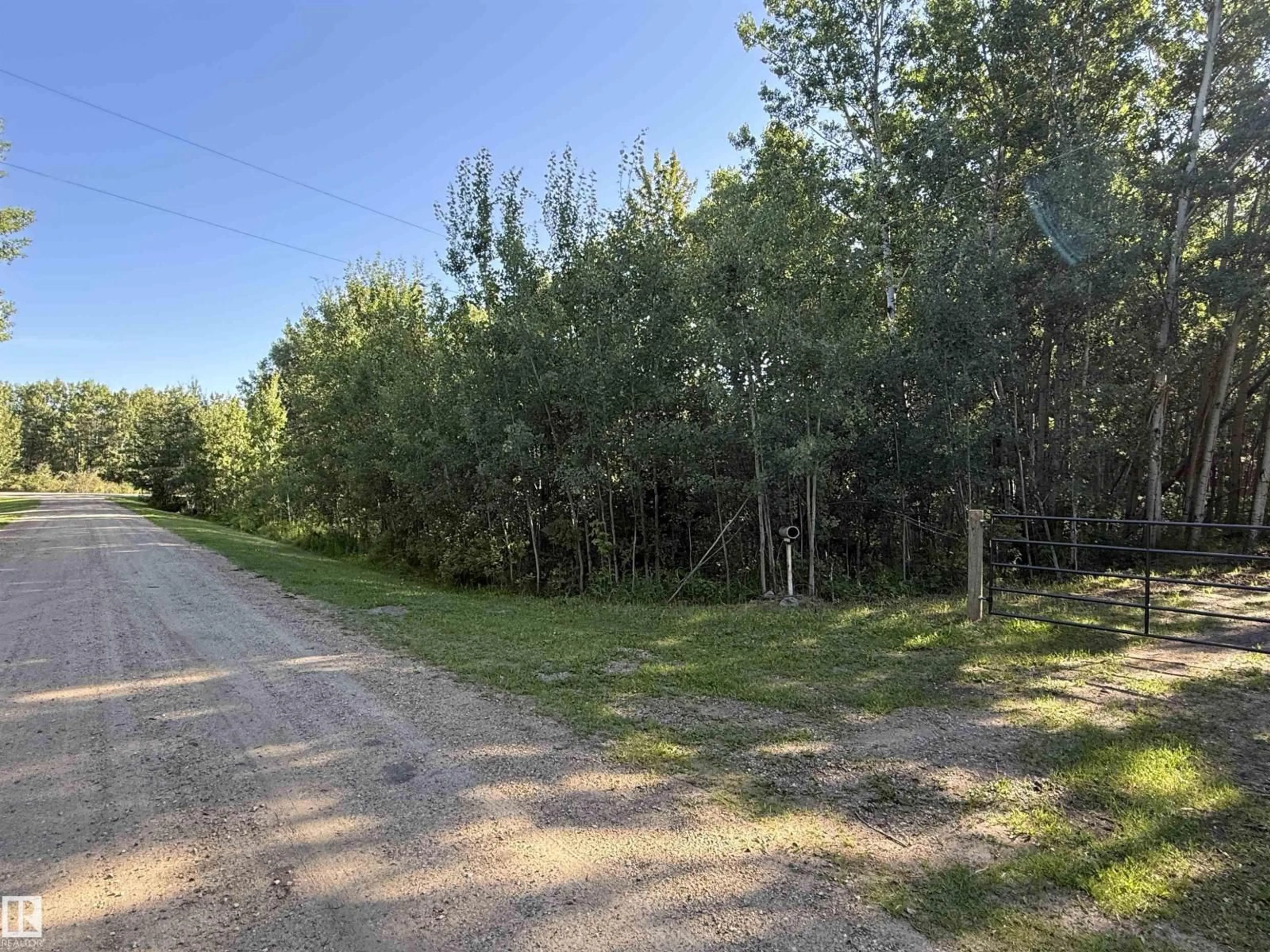 A pic from outside/outdoor area/front of a property/back of a property/a pic from drone, forest/trees view for 7 - 53104 RGE ROAD 13, Rural Parkland County Alberta T7Y2T2