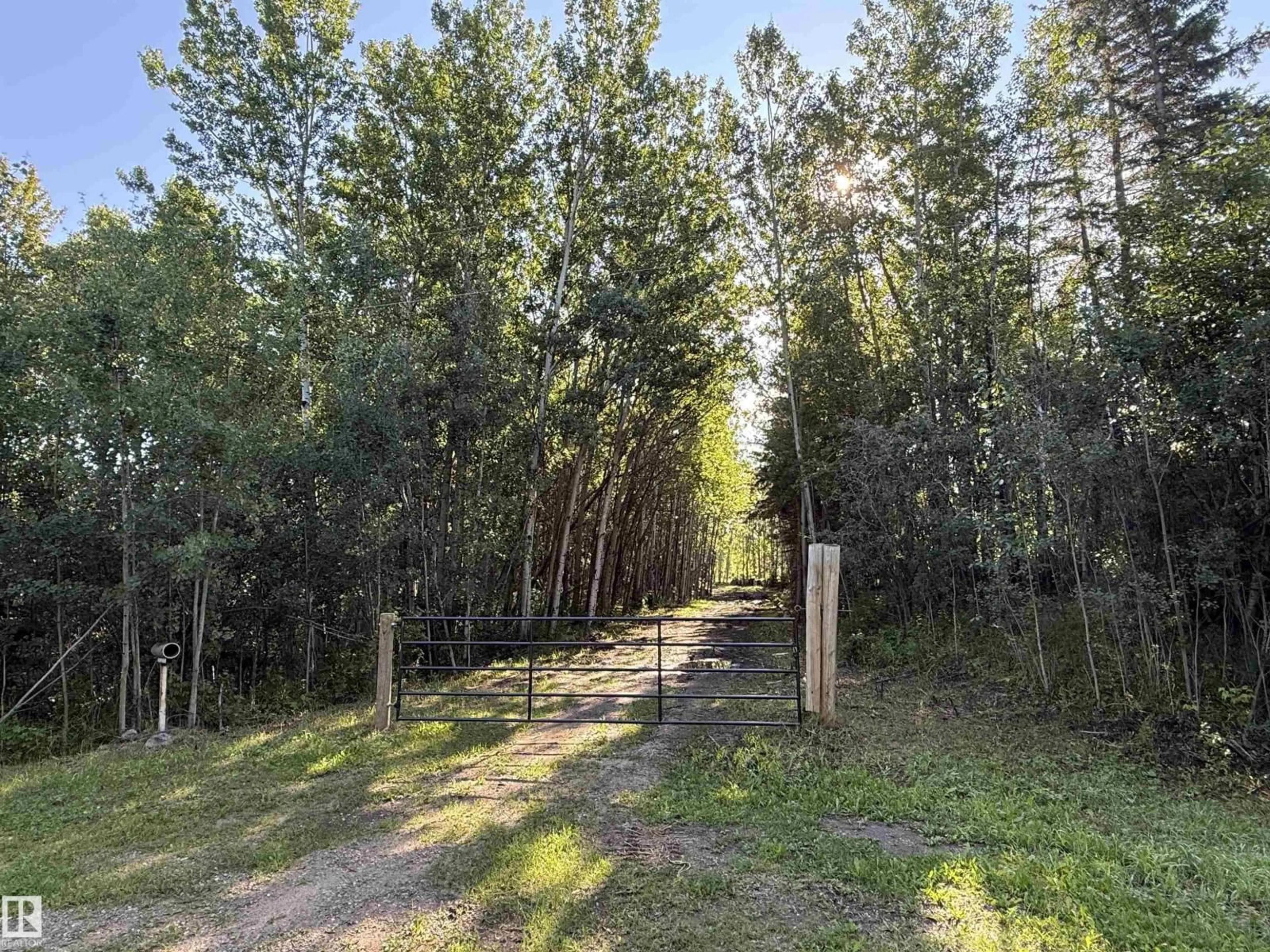 A pic from outside/outdoor area/front of a property/back of a property/a pic from drone, forest/trees view for 7 - 53104 RGE ROAD 13, Rural Parkland County Alberta T7Y2T2