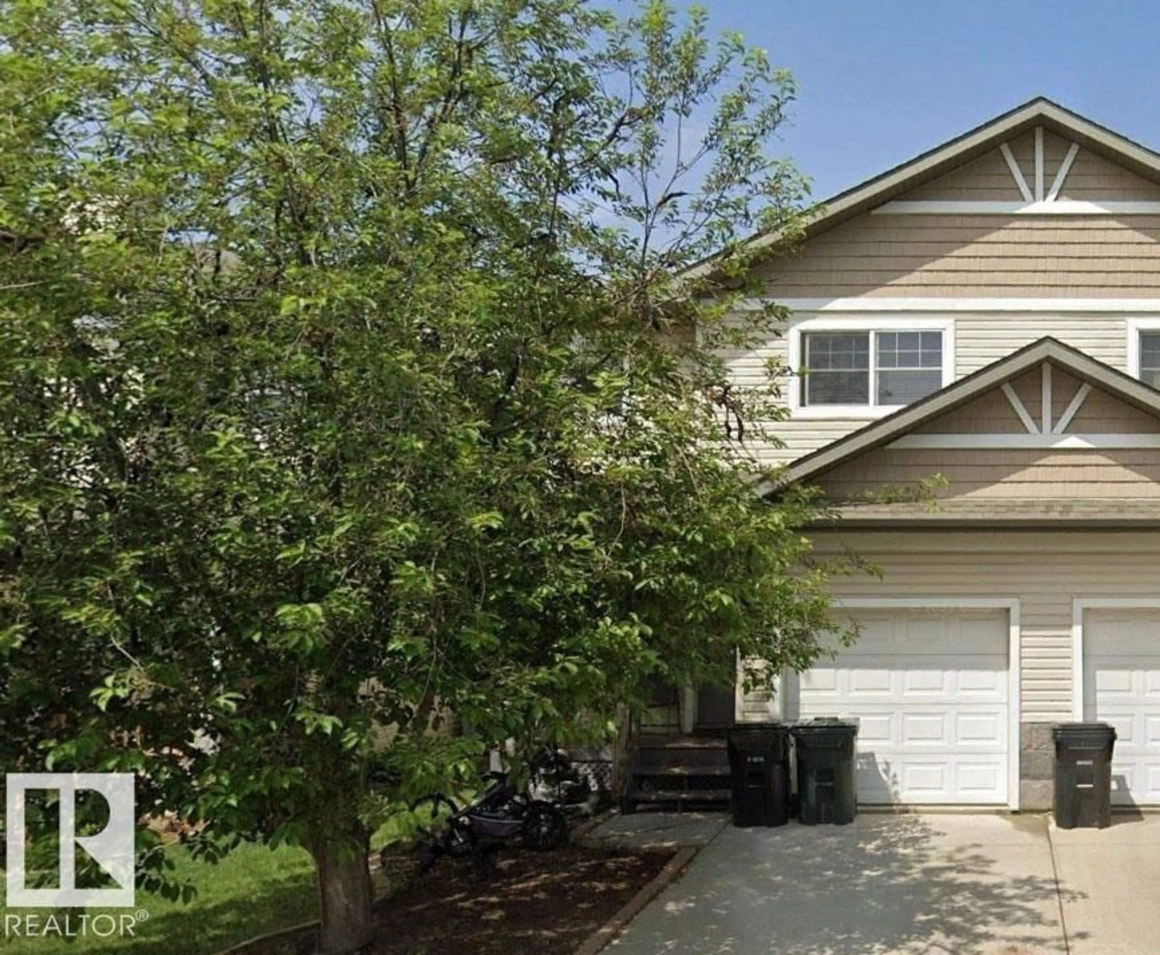 Home with vinyl exterior material, street for 64 HARTWICK LD, Spruce Grove Alberta T7X9A5