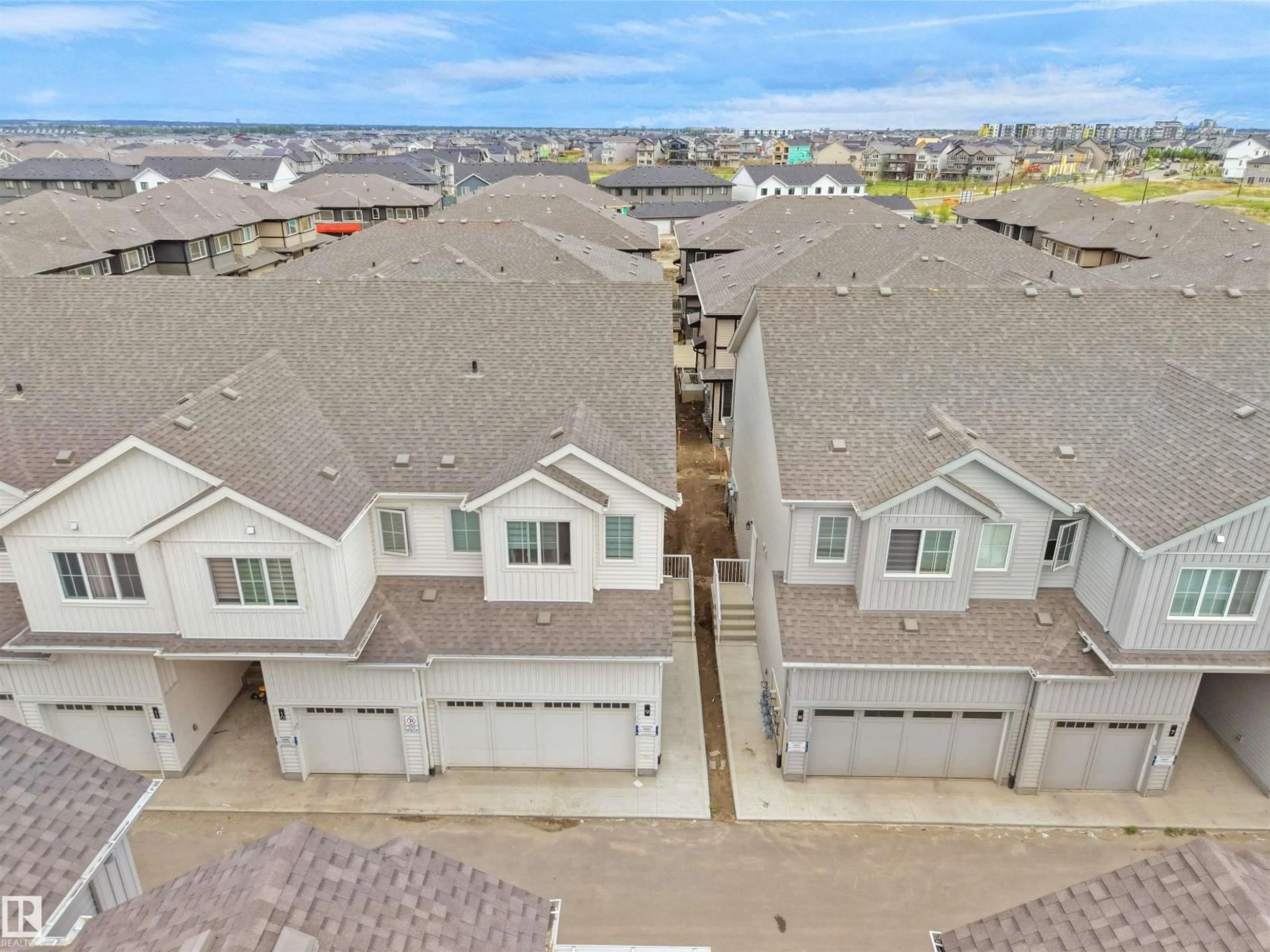 A pic from outside/outdoor area/front of a property/back of a property/a pic from drone, street for #9 - 7110 KESWICK COMMON, Edmonton Alberta T6W5P7