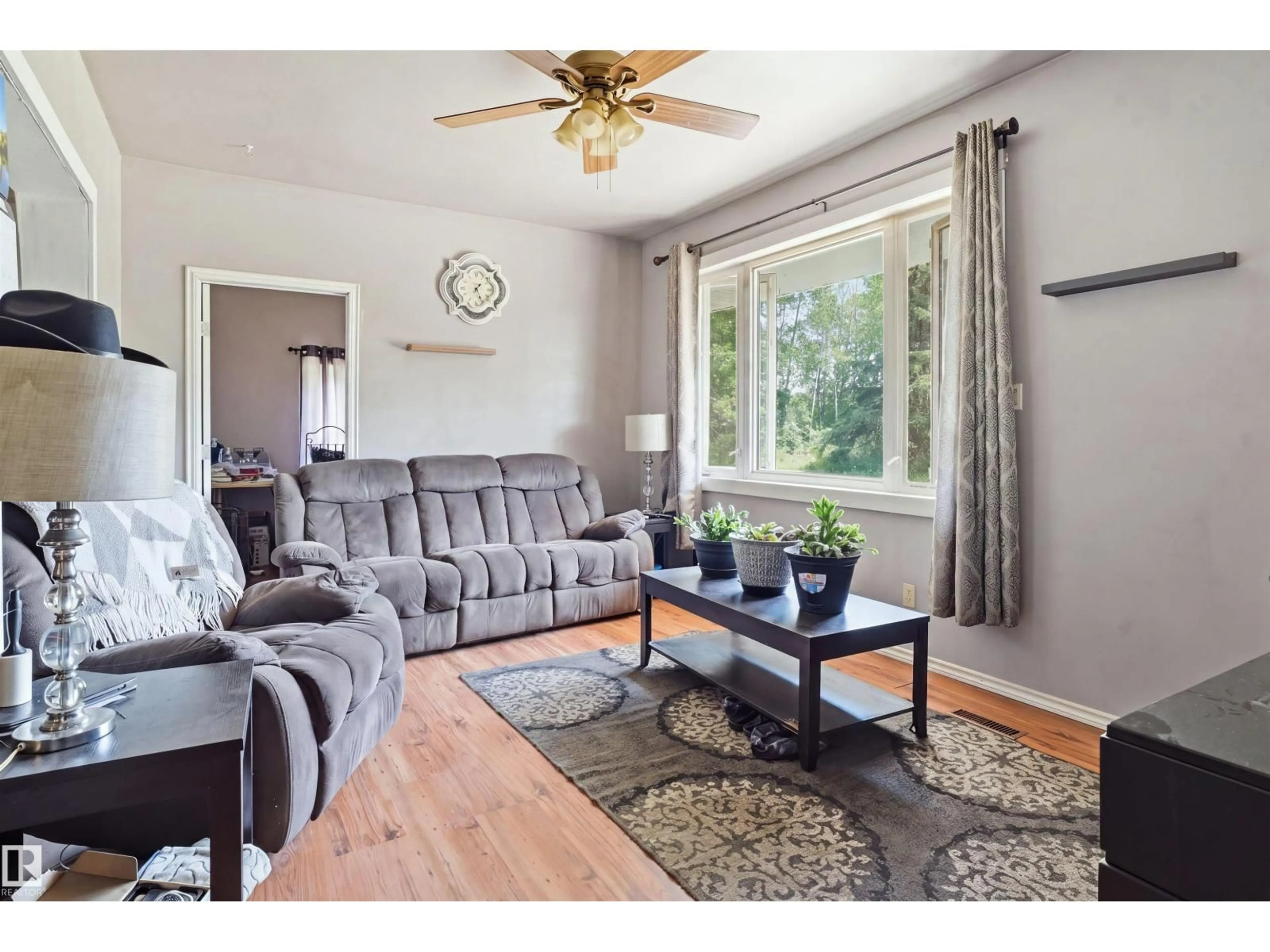 Living room with furniture, wood/laminate floor for 60104 RGE ROAD 240A, Rural Westlock County Alberta T0G0P0
