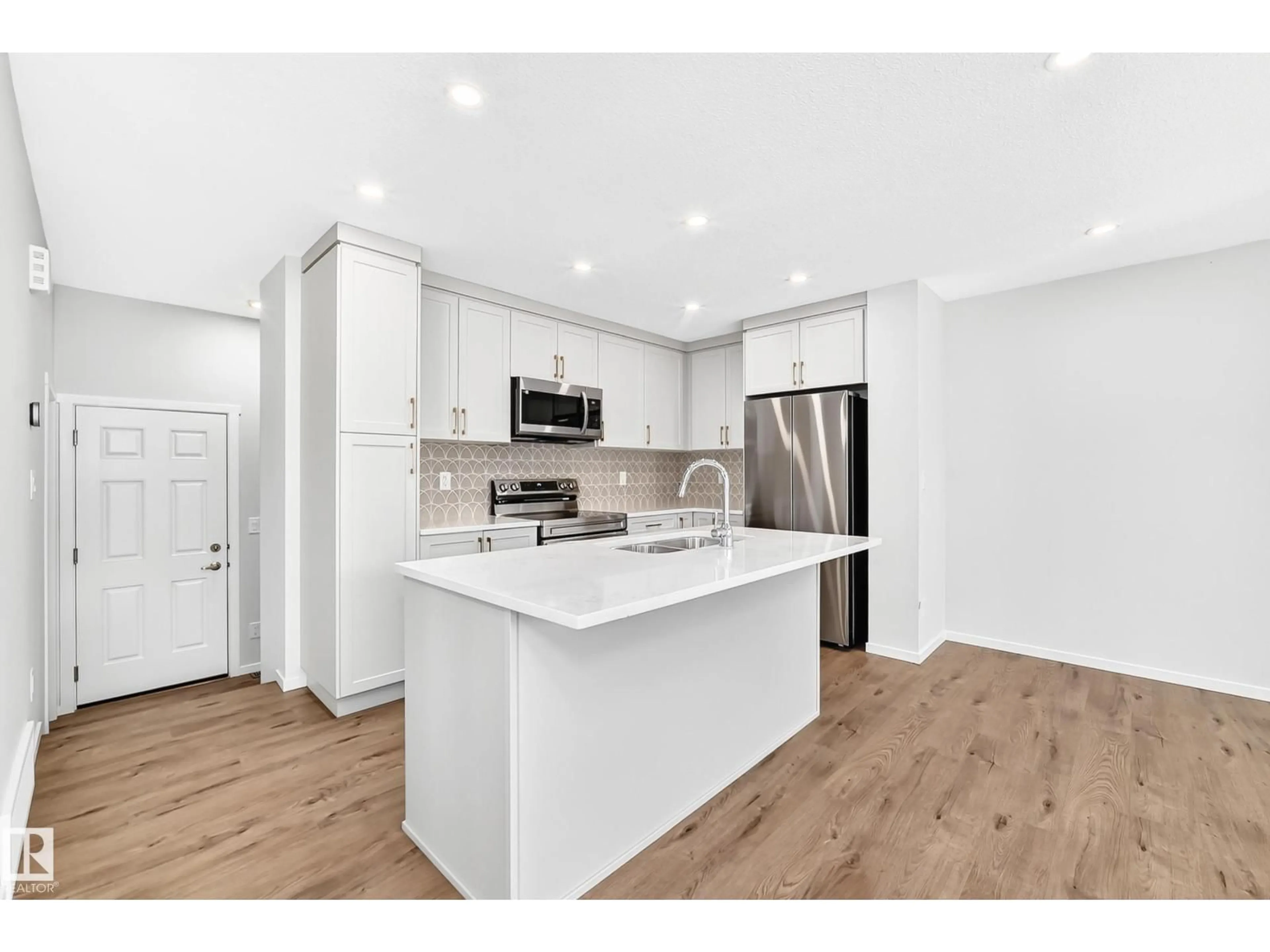 Open concept kitchen, wood/laminate floor for 1089 HEARTHSTONE BV, Sherwood Park Alberta T8H3B3