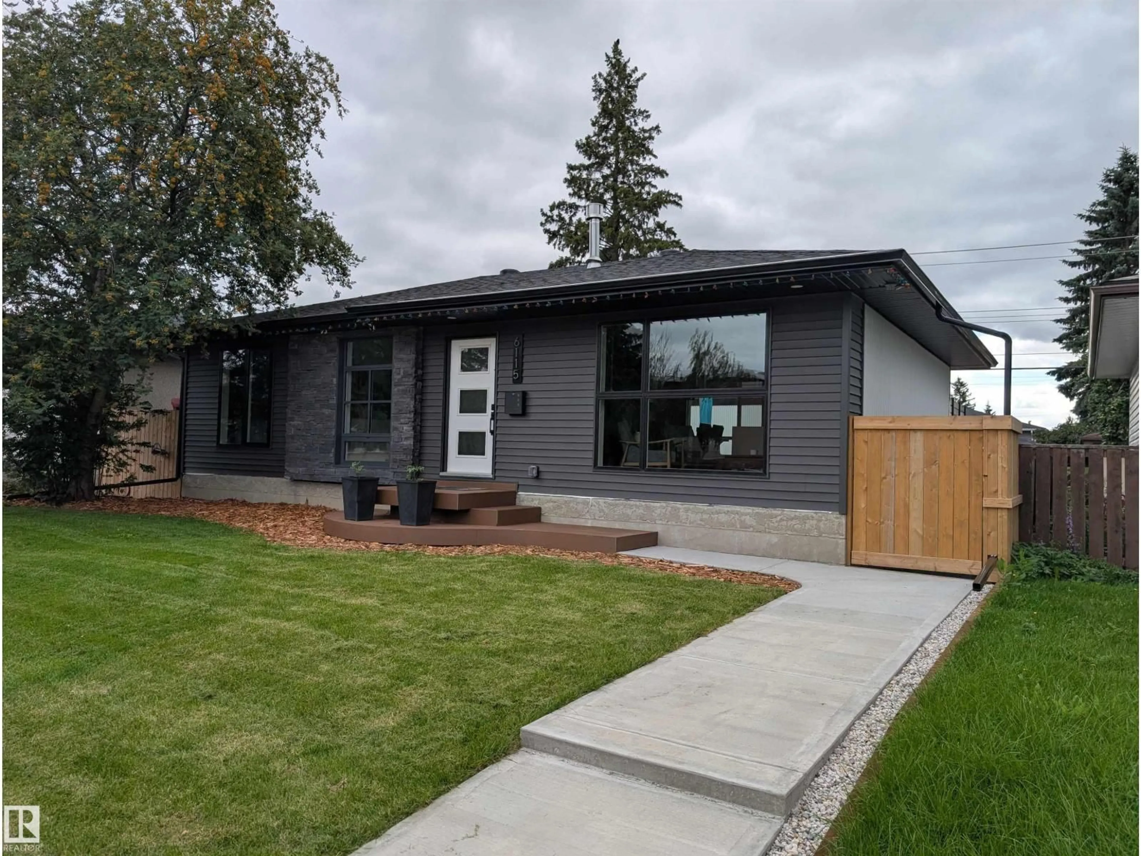 Home with vinyl exterior material, street for 6115 95 AV, Edmonton Alberta T6B1A6