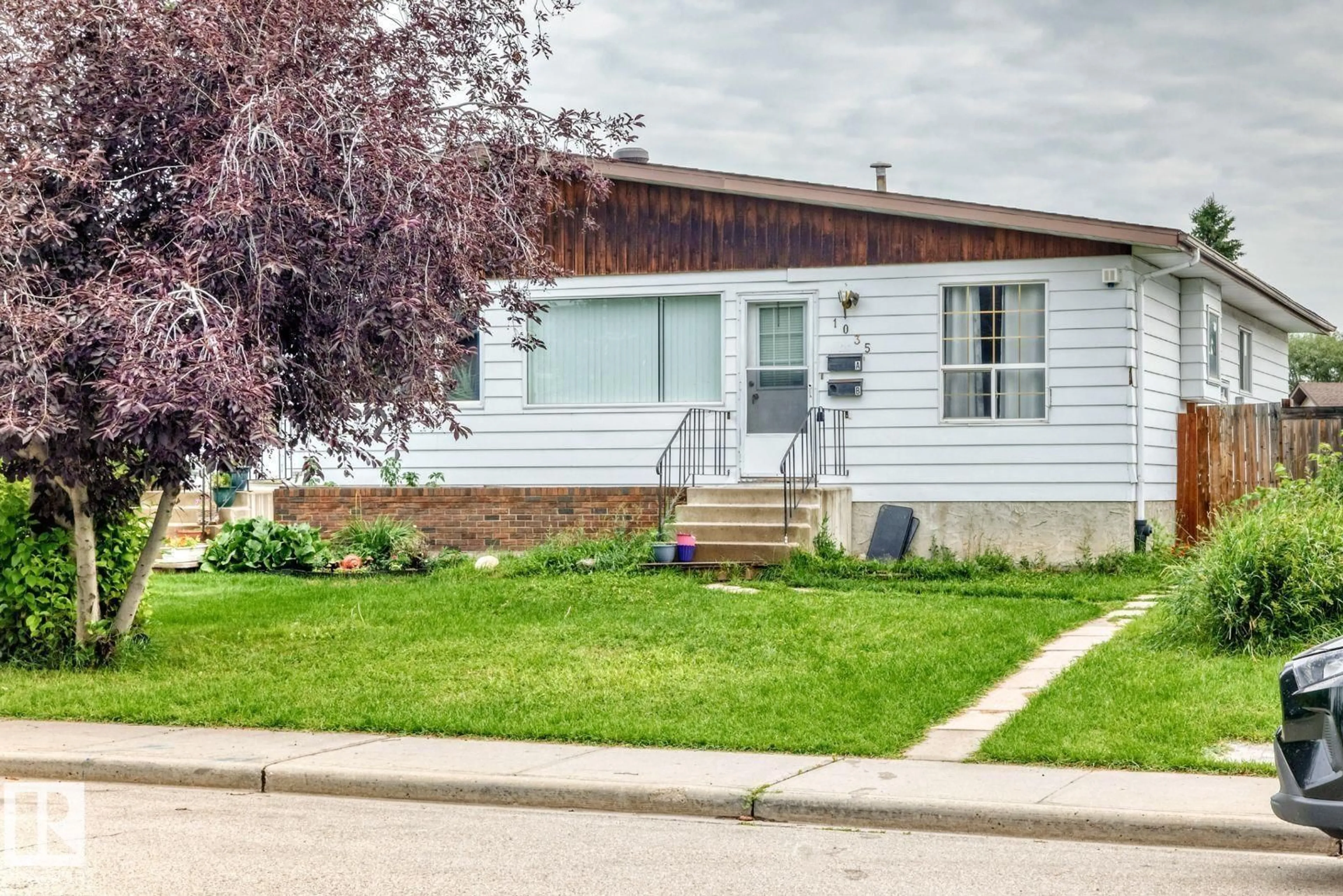 Home with vinyl exterior material, street for 1035 LAKEWOOD RD, Edmonton Alberta T6K3B1