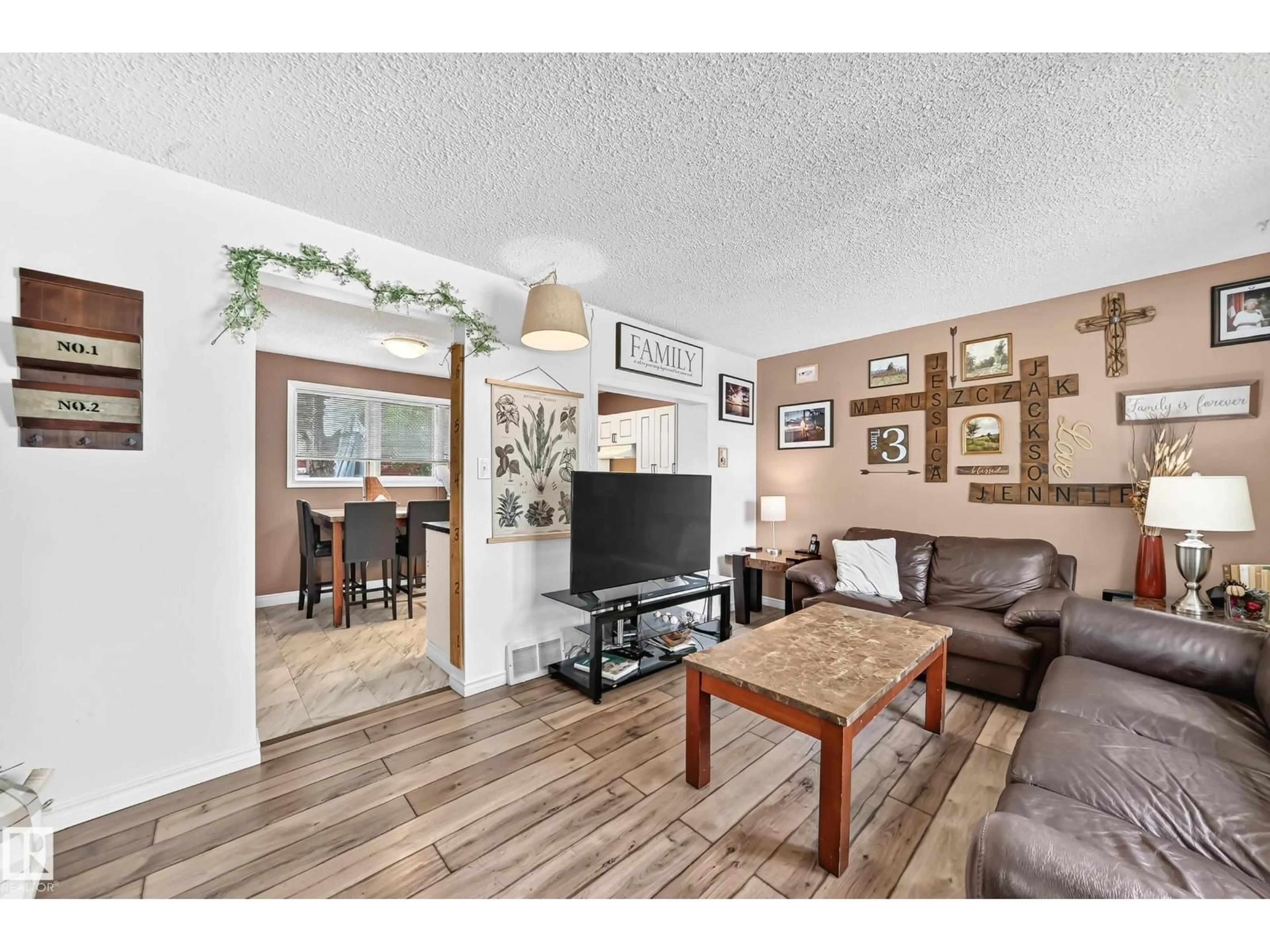 Living room with furniture, wood/laminate floor for 64 HABITAT CR, Edmonton Alberta T5A2X7
