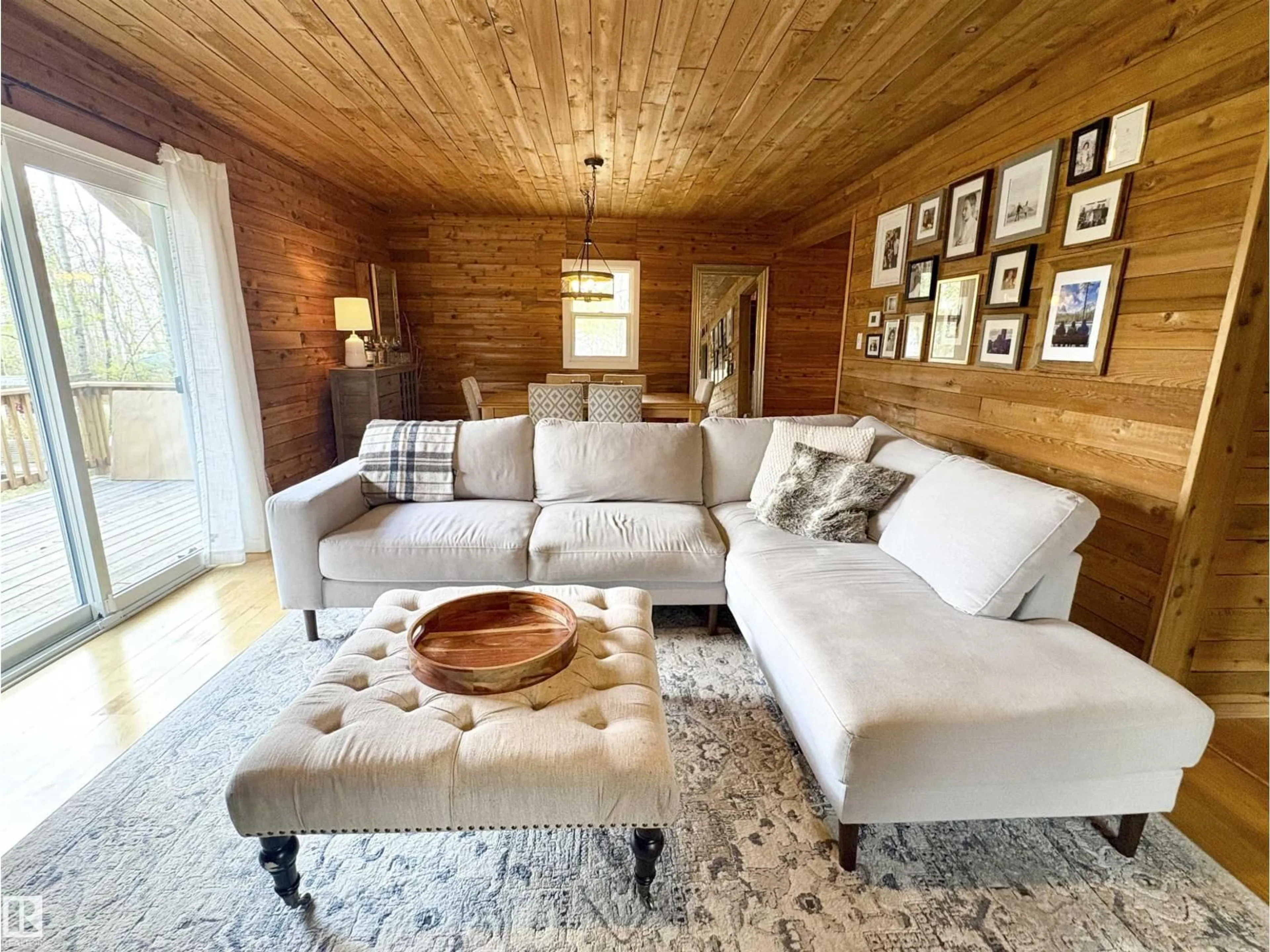 Living room with furniture, wood/laminate floor for 1010 47402 RGE RD 13, Rural Leduc County Alberta T0C2P0