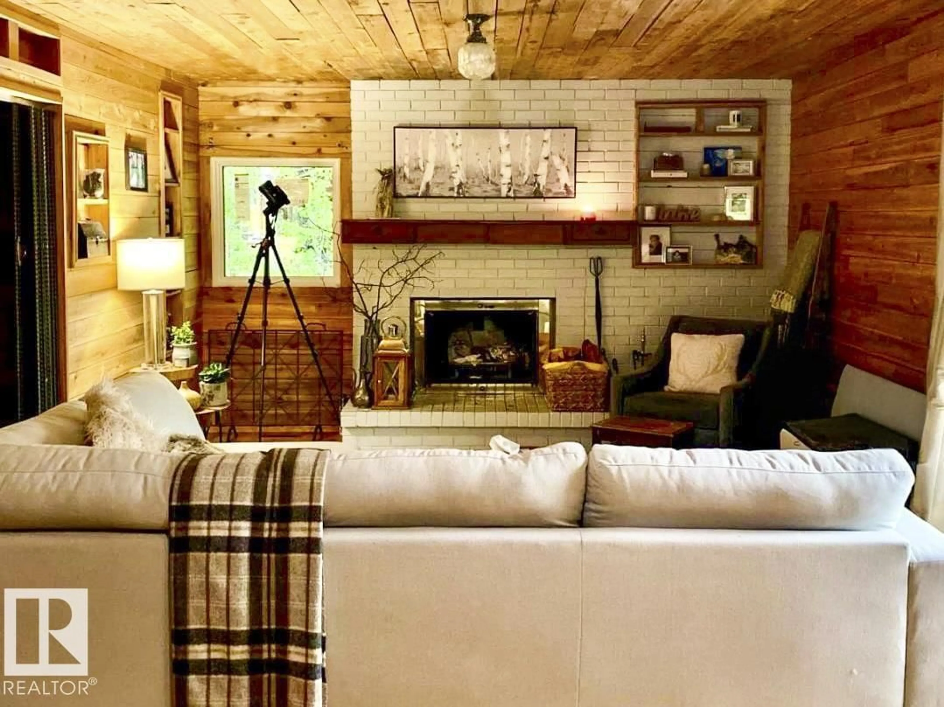 Living room with furniture, wood/laminate floor for 1010 47402 RGE RD 13, Rural Leduc County Alberta T0C2P0