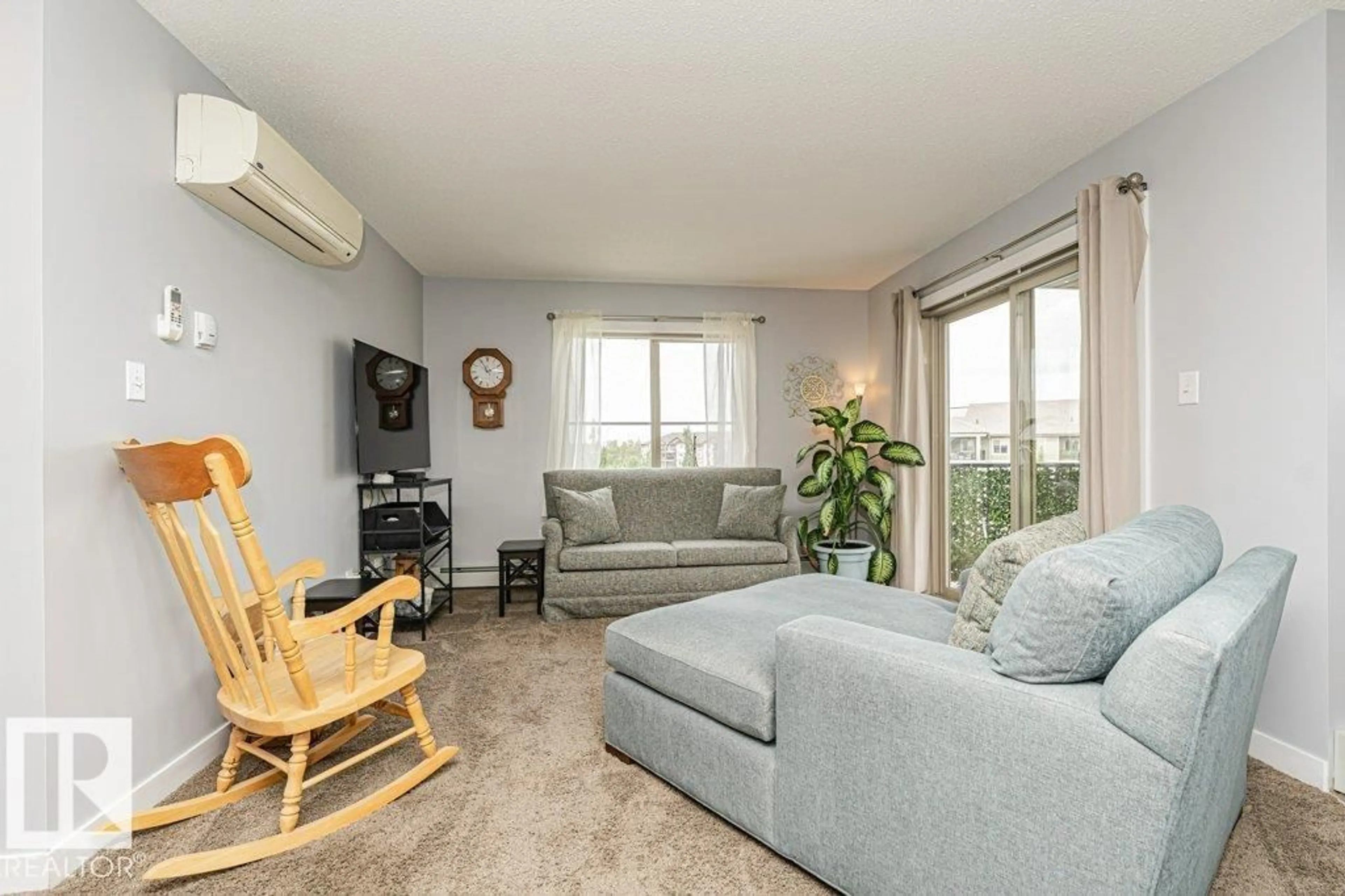Living room with furniture, wood/laminate floor for #402 - 270 MCCONACHIE DR, Edmonton Alberta T5Y3N4
