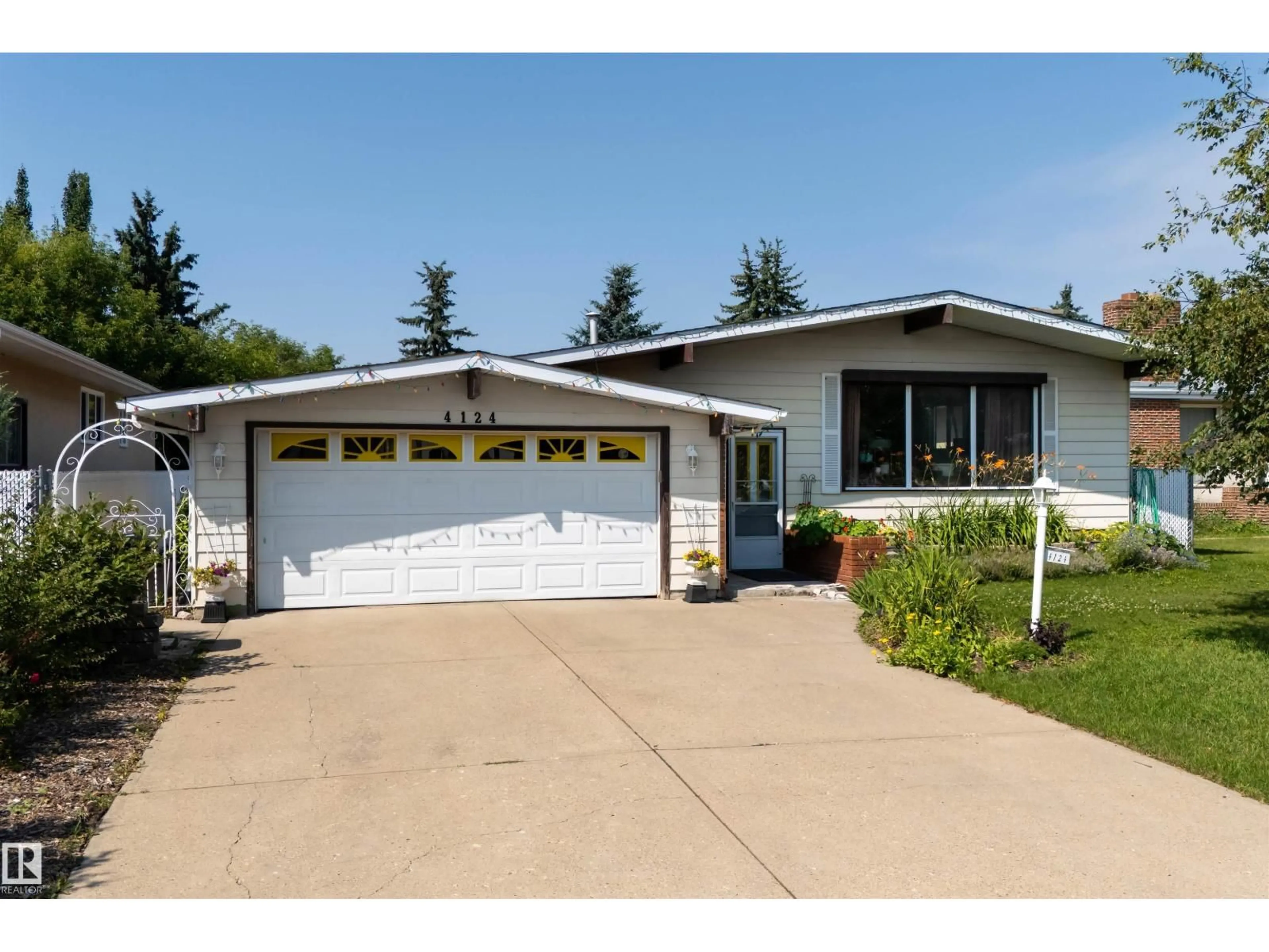 Home with vinyl exterior material, street for NW - 4124 110 ST, Edmonton Alberta T6J2T5