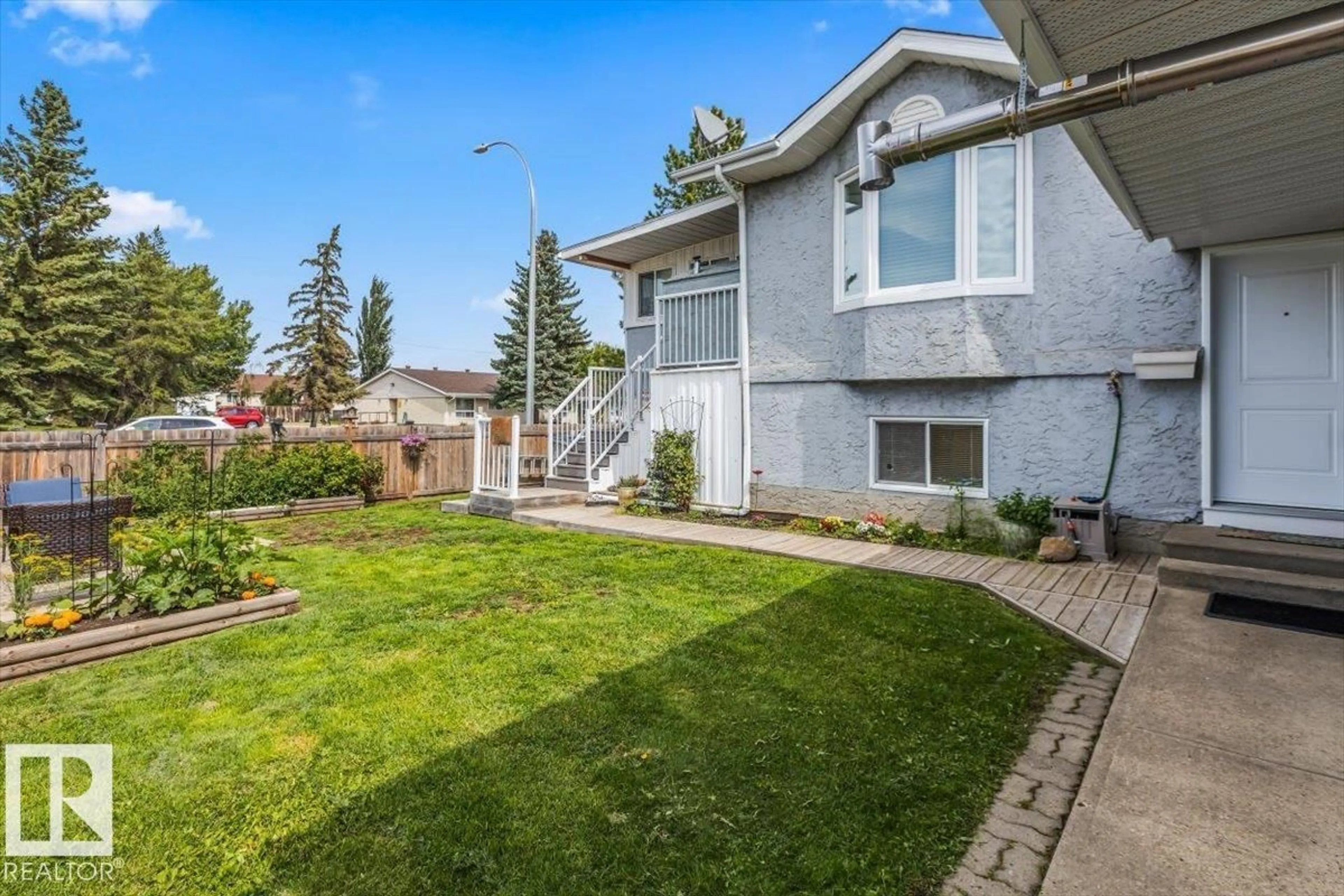 Home with vinyl exterior material, street for 10021 106 ST, Morinville Alberta T8R1A3