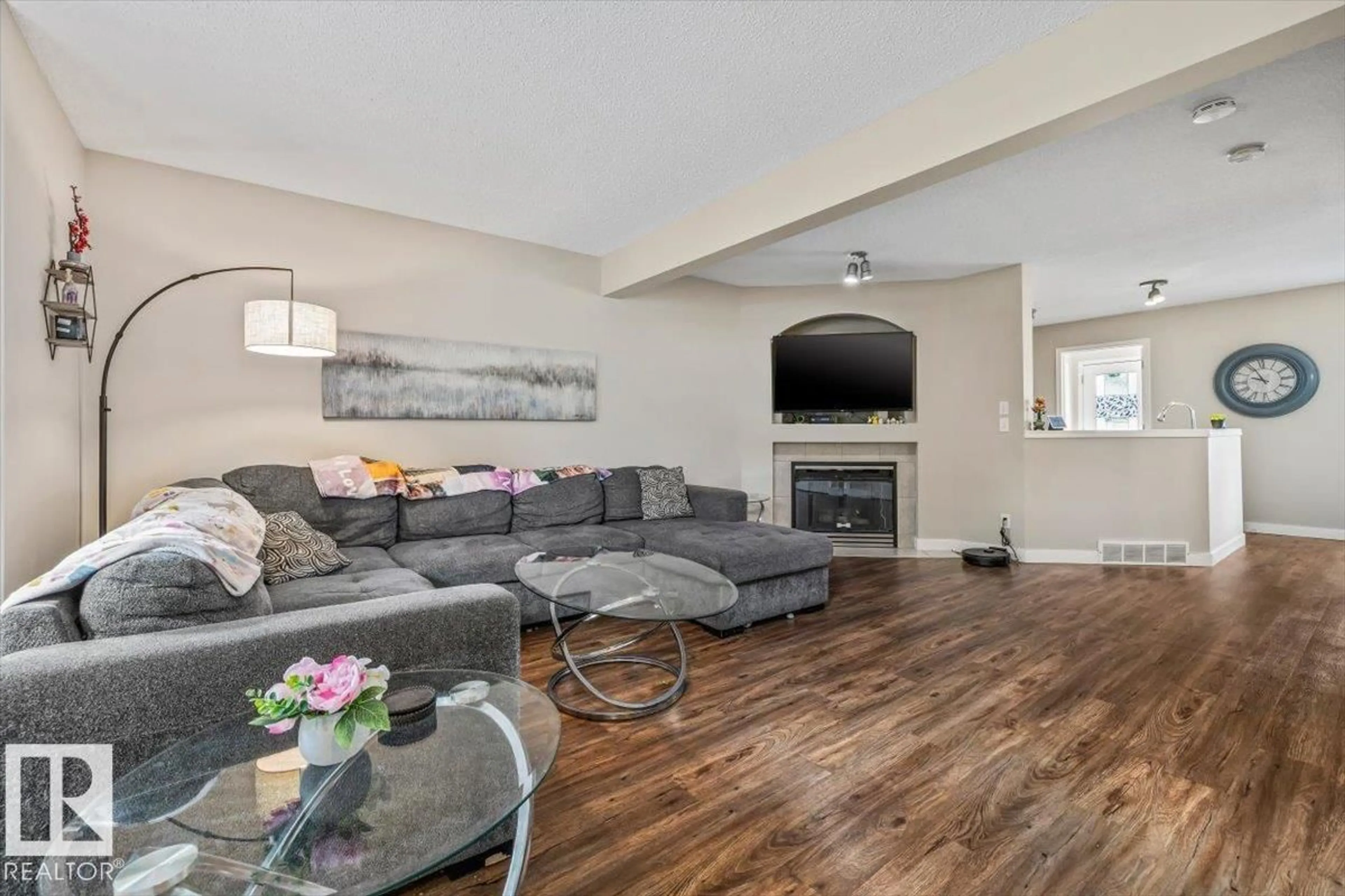 Living room with furniture, wood/laminate floor for 4744 TERWILLEGAR CM, Edmonton Alberta T6R3H6