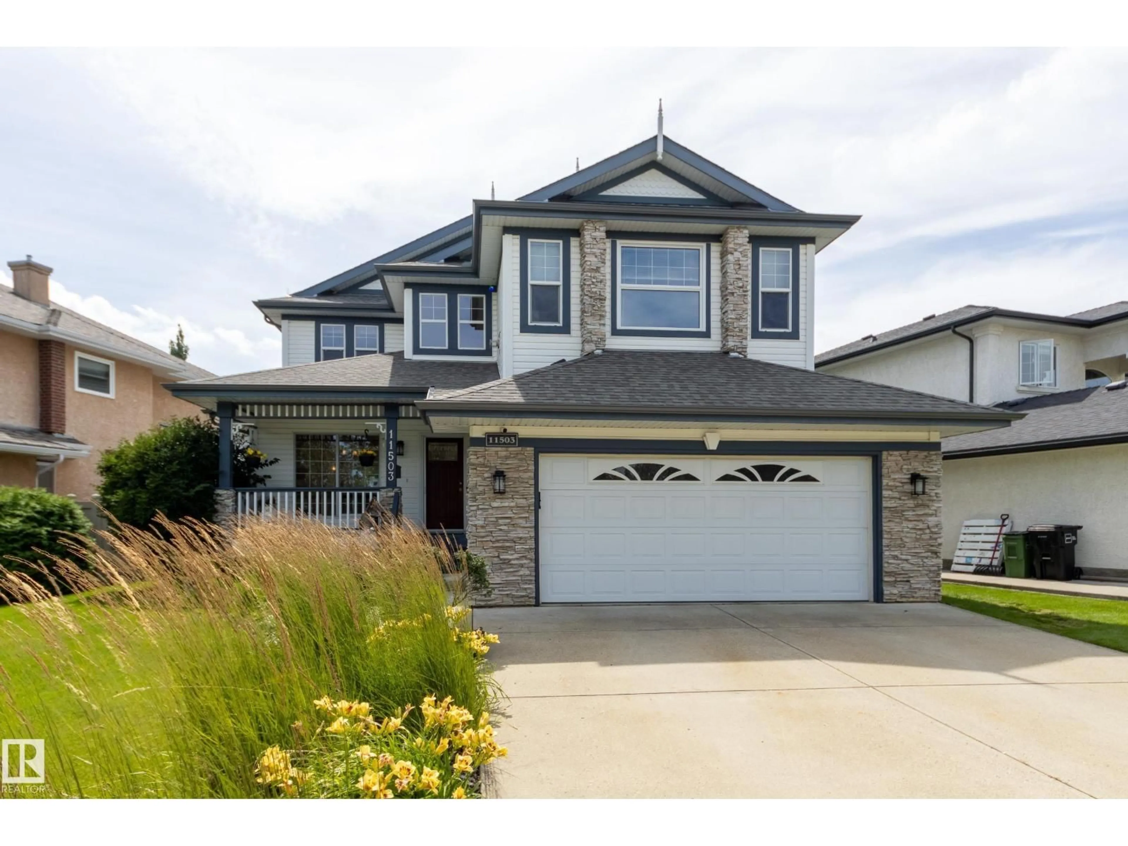 Home with vinyl exterior material, street for 11503 15 AV, Edmonton Alberta T6J7B8