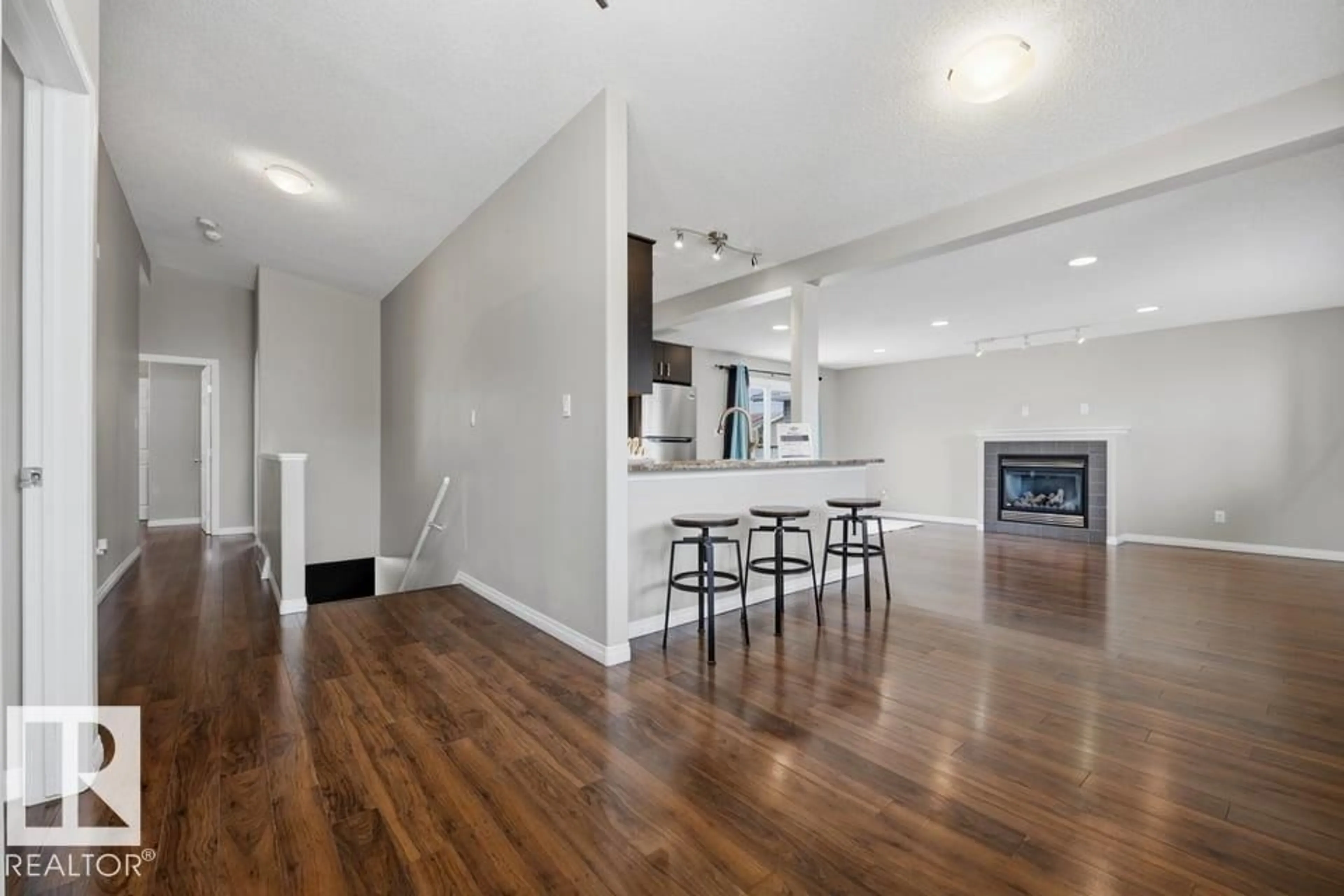 Open concept kitchen, wood/laminate floor for 7119 136 AV, Edmonton Alberta T5C2K3