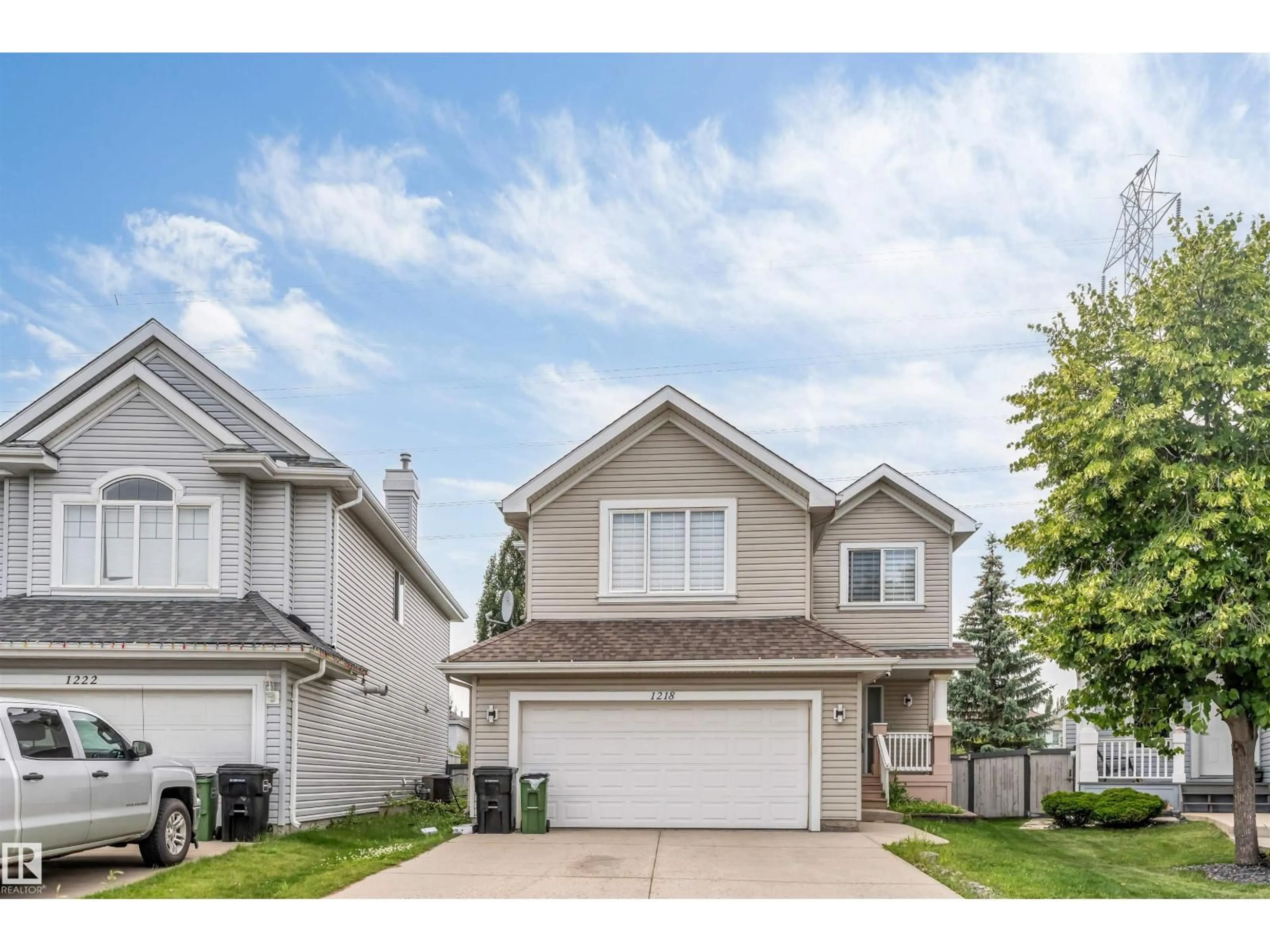 Home with vinyl exterior material, street for 1218 87A STREET, Edmonton Alberta T6X1C6