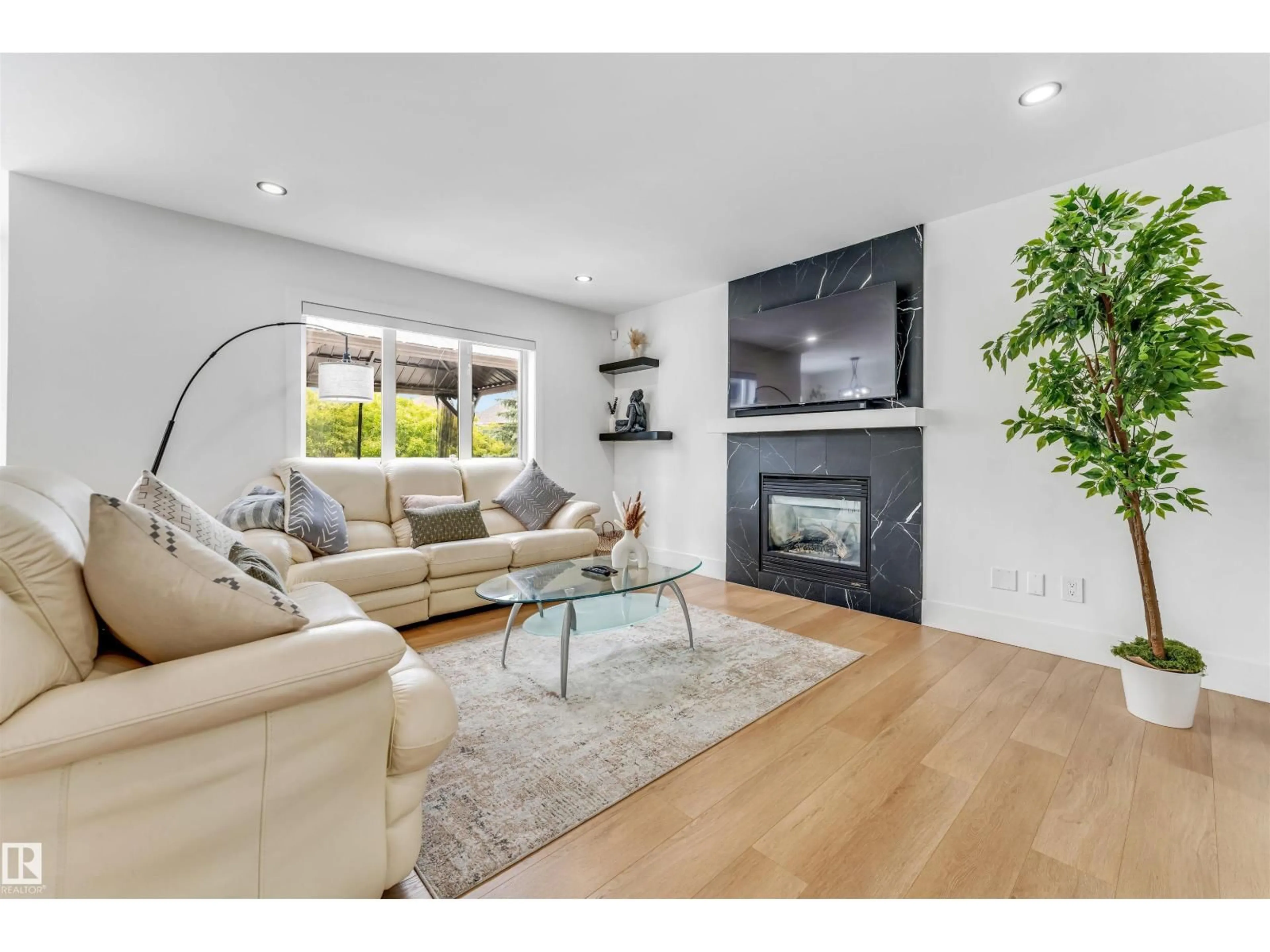 Living room with furniture, wood/laminate floor for 1218 87A STREET, Edmonton Alberta T6X1C6