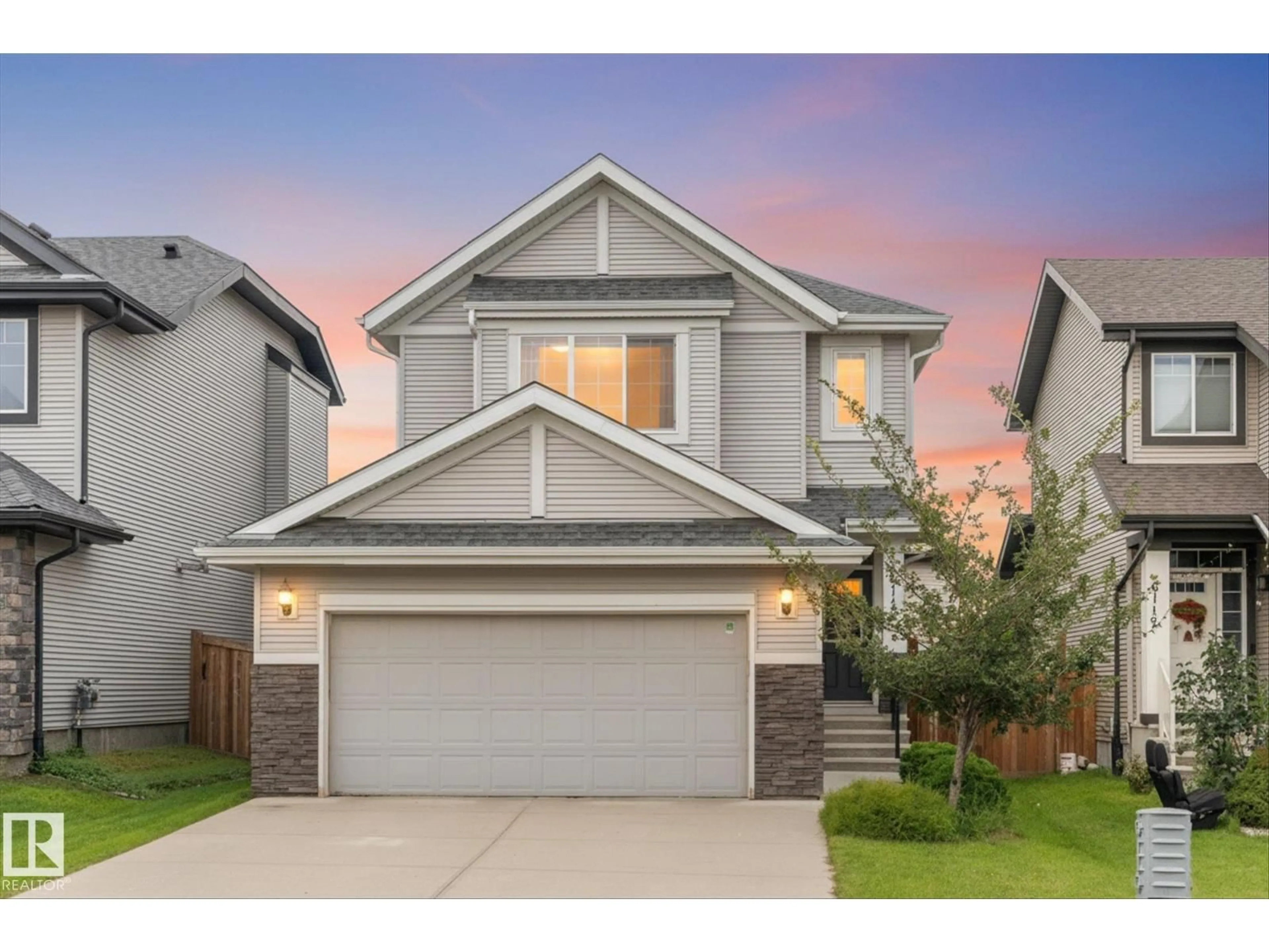 Home with vinyl exterior material, street for NW - 6116 175 AV, Edmonton Alberta T5Y3N7