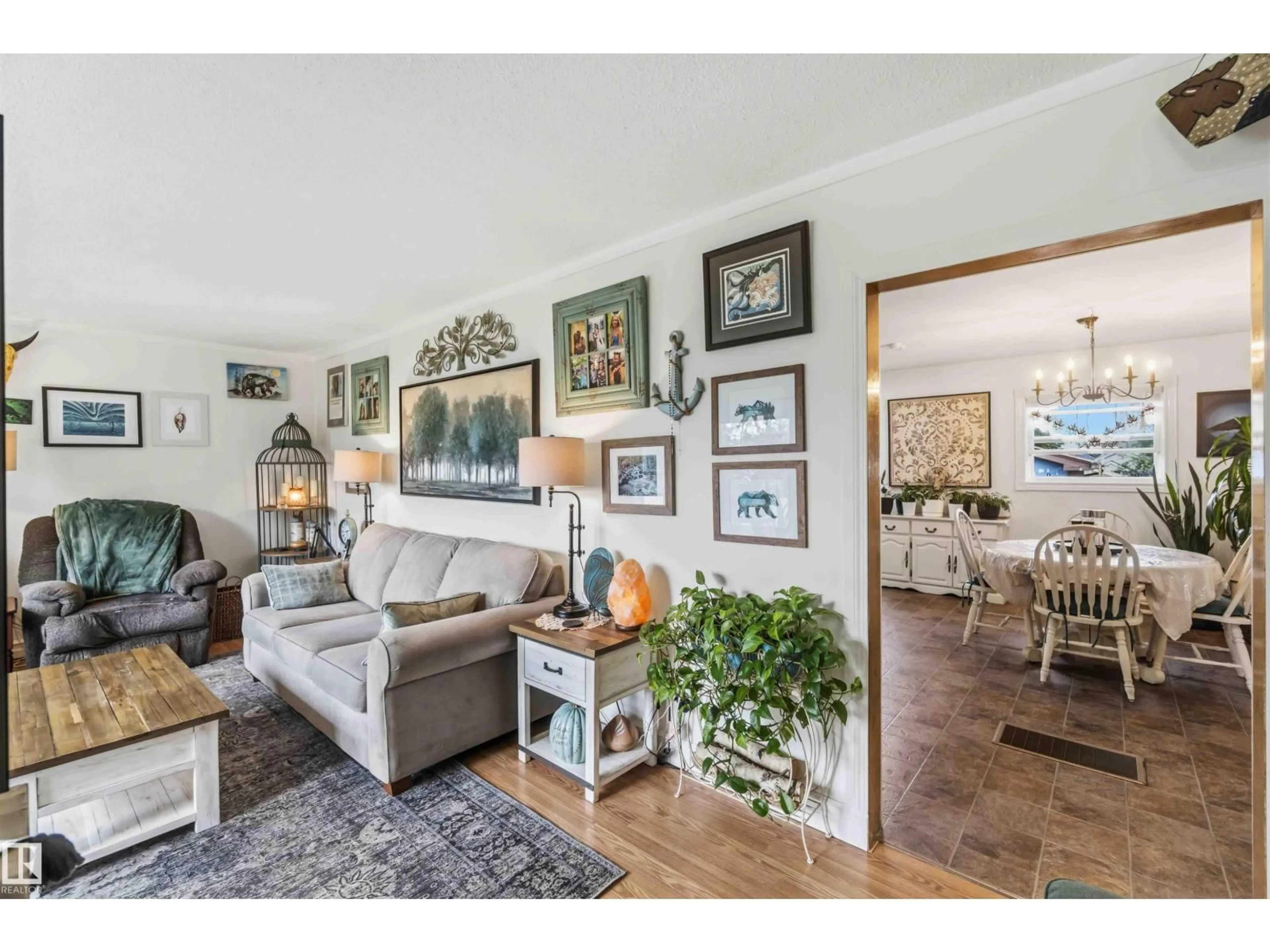 Living room with furniture, wood/laminate floor for 10144 105 ST, Westlock Alberta T7P1V9