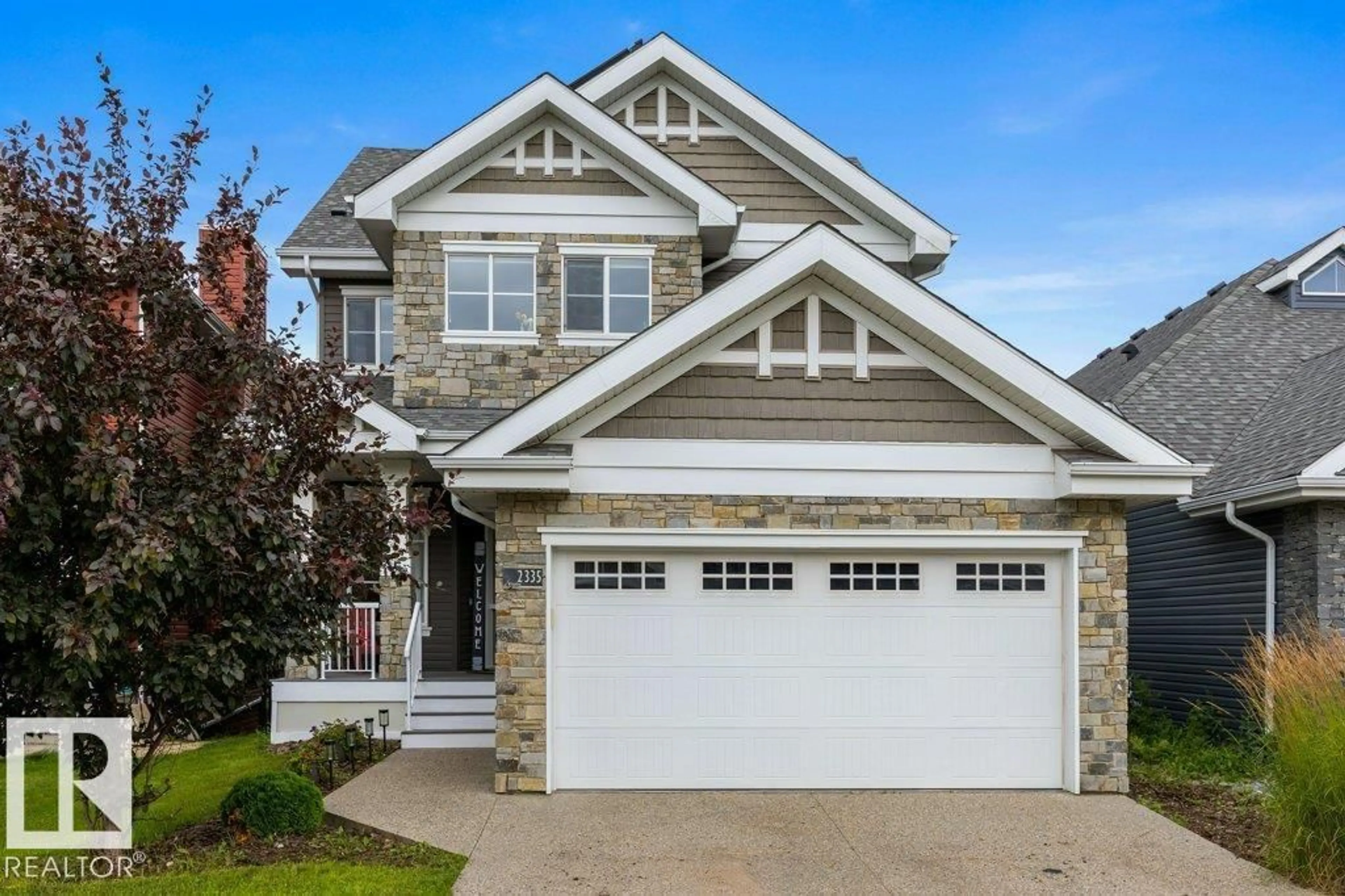 Home with vinyl exterior material, street for 2335 SPARROW CR, Edmonton Alberta T5S0G8