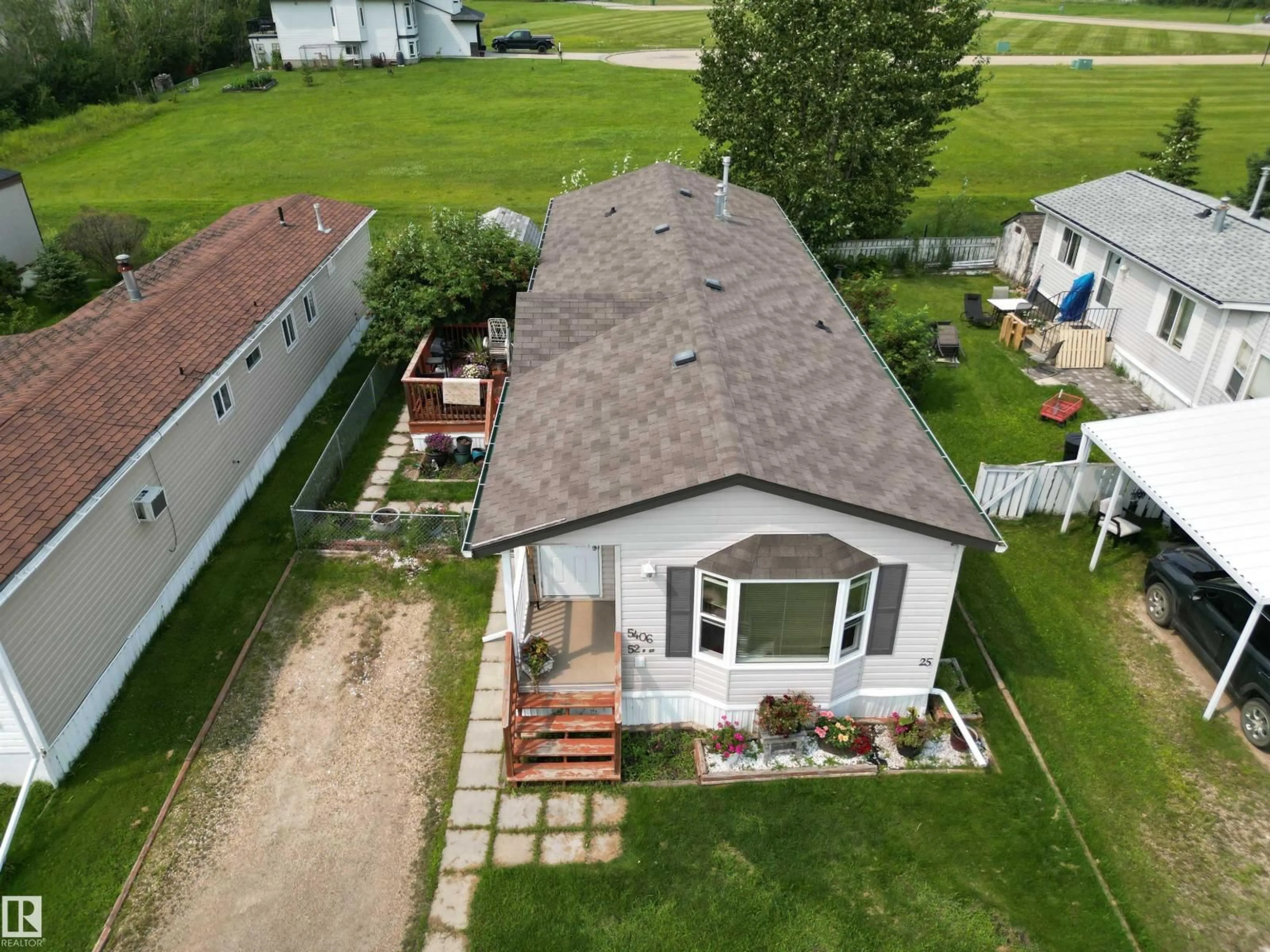 A pic from outside/outdoor area/front of a property/back of a property/a pic from drone, water/lake/river/ocean view for 5406 52A ST, Tofield Alberta T0B4J0