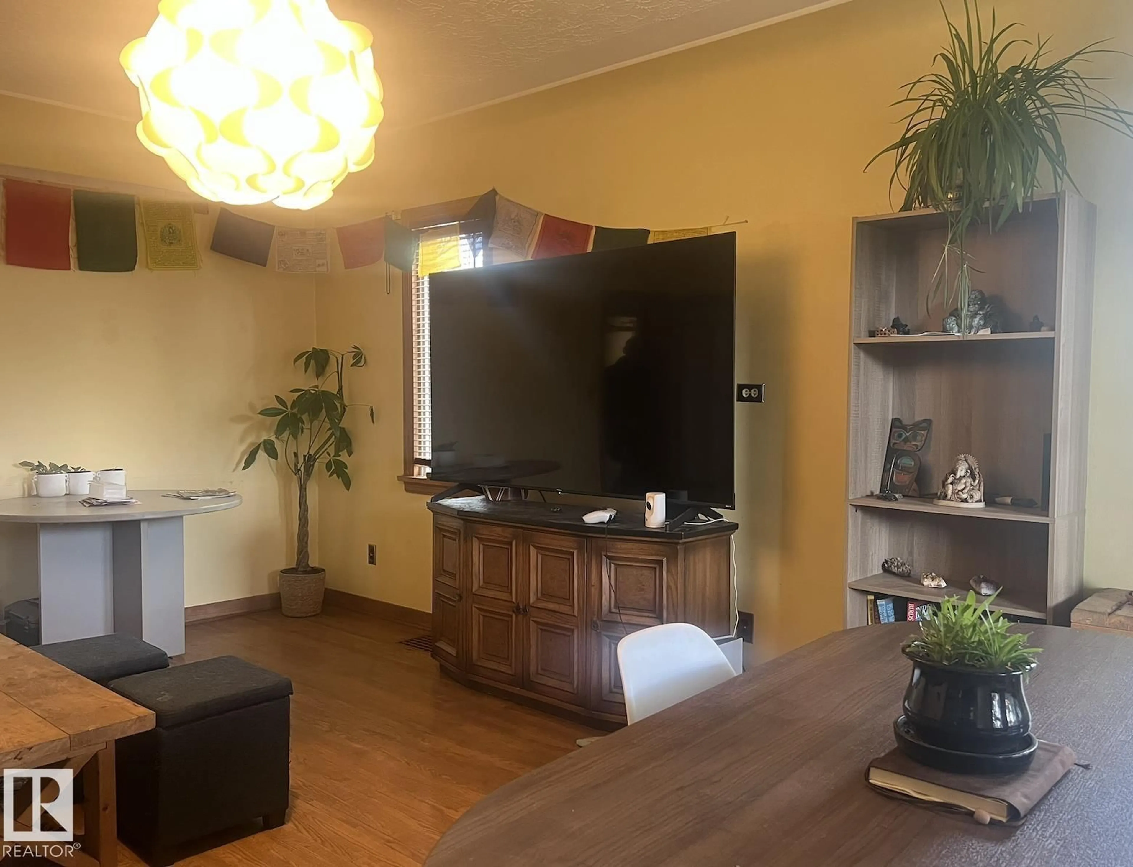 Living room with furniture, wood/laminate floor for 9828 84 AV, Edmonton Alberta T6E2G2