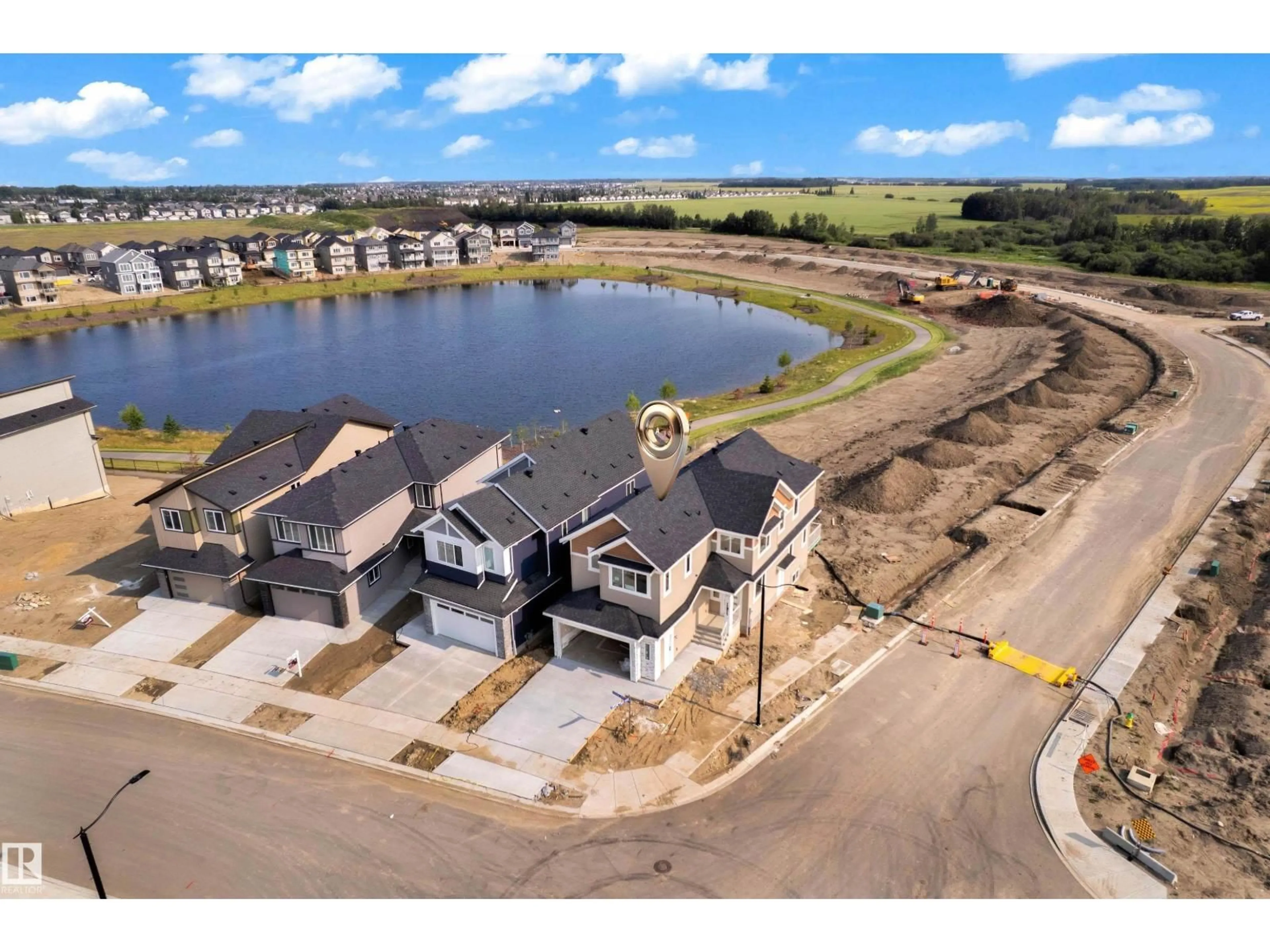 A pic from outside/outdoor area/front of a property/back of a property/a pic from drone, water/lake/river/ocean view for 465 CRYSTAL CREEK LI, Leduc Alberta T9E0X5