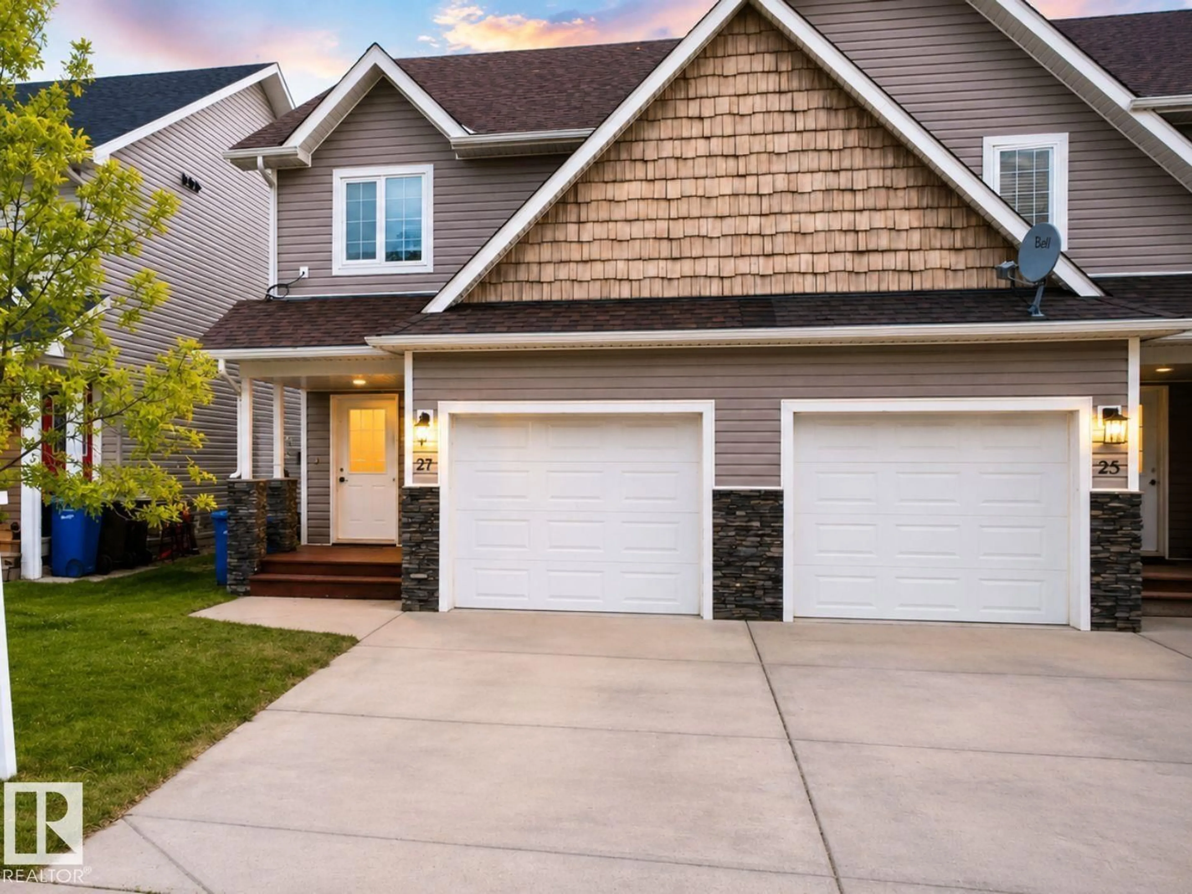 Home with vinyl exterior material, street for 27 DEER COULEE DR, Didsbury Alberta T0M0W0