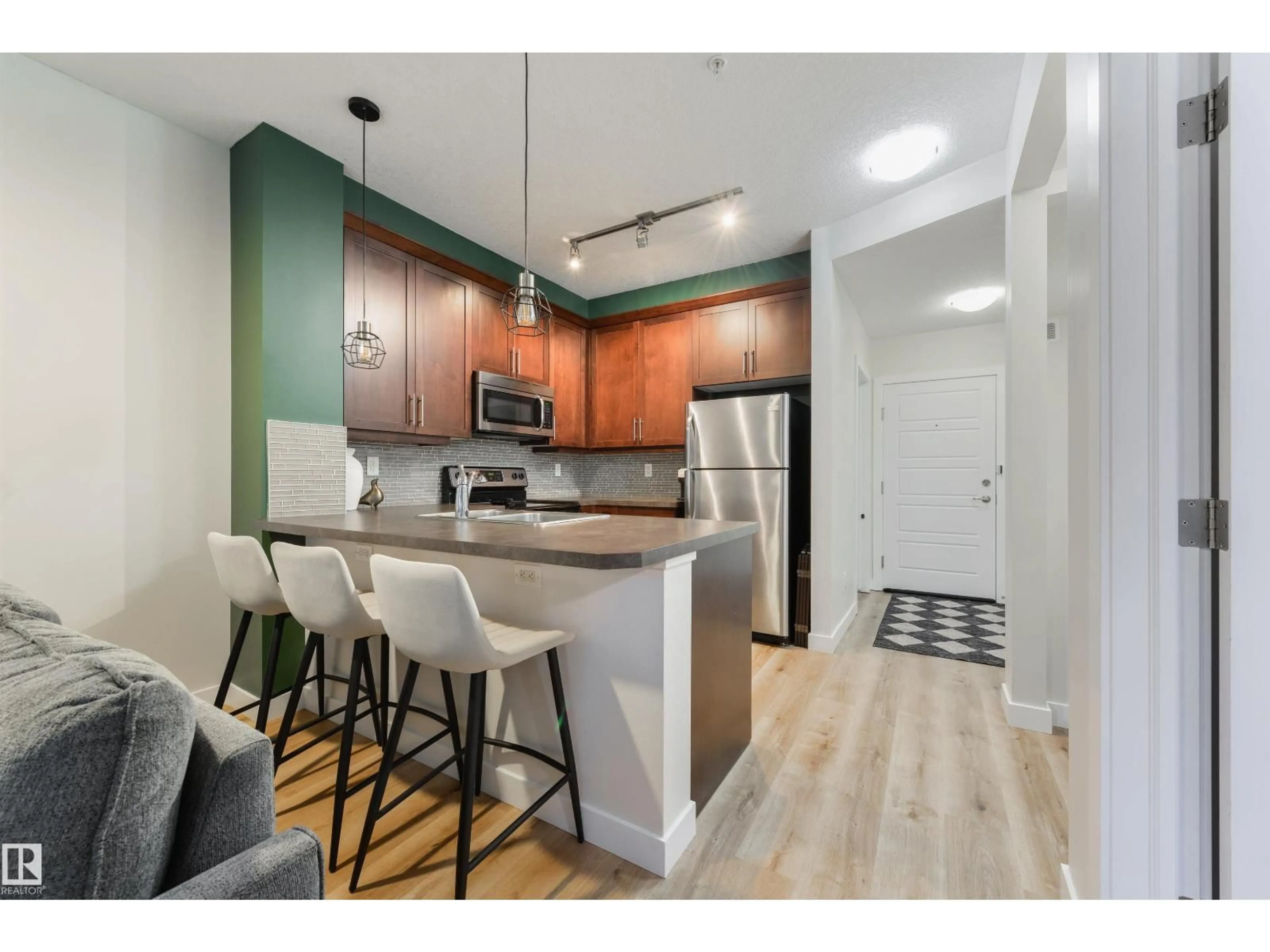 Open concept kitchen, wood/laminate floor for 2590 - 110 ANDERSON WY, Edmonton Alberta T6W0R2