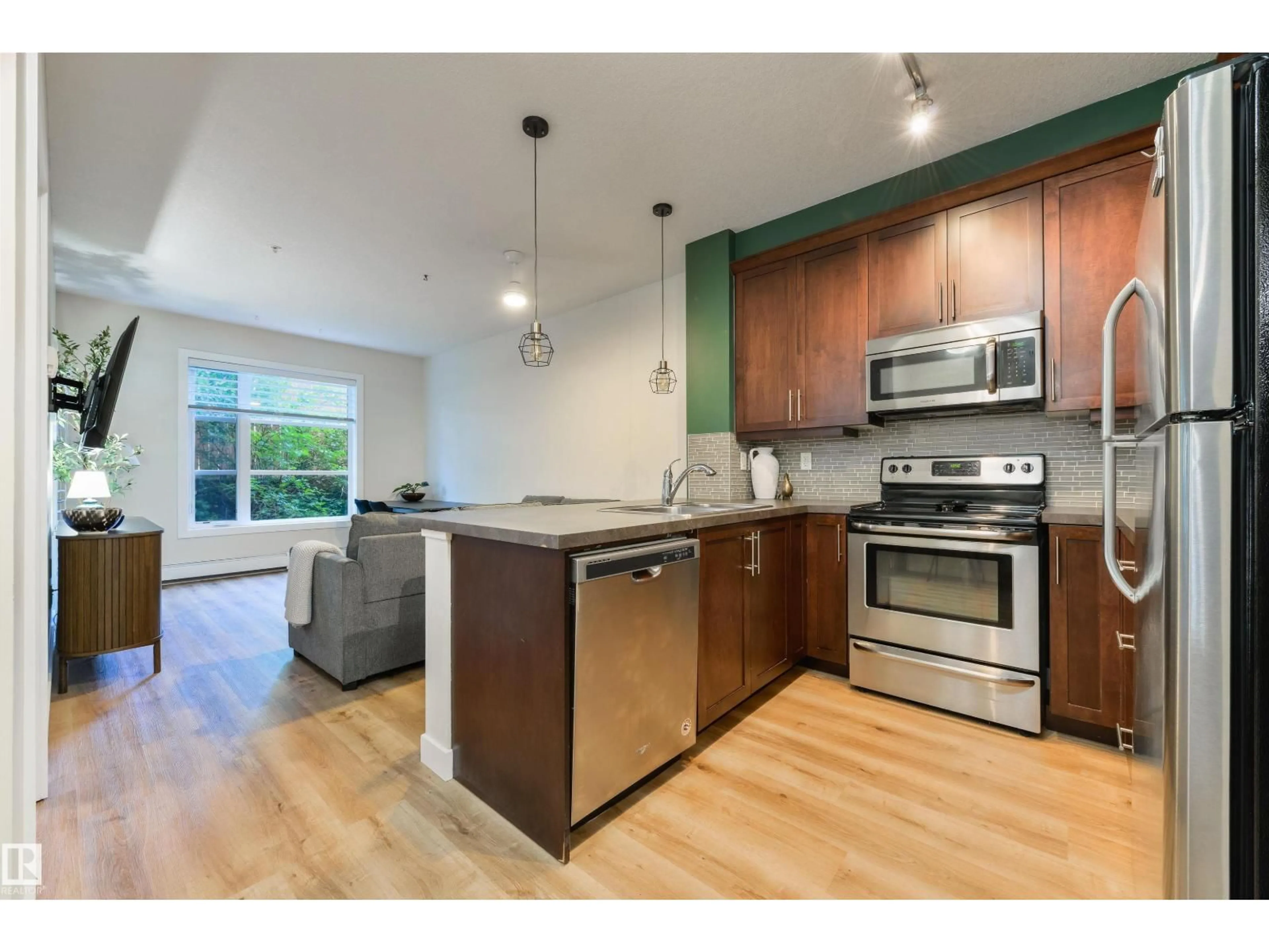 Open concept kitchen, wood/laminate floor for 2590 - 110 ANDERSON WY, Edmonton Alberta T6W0R2
