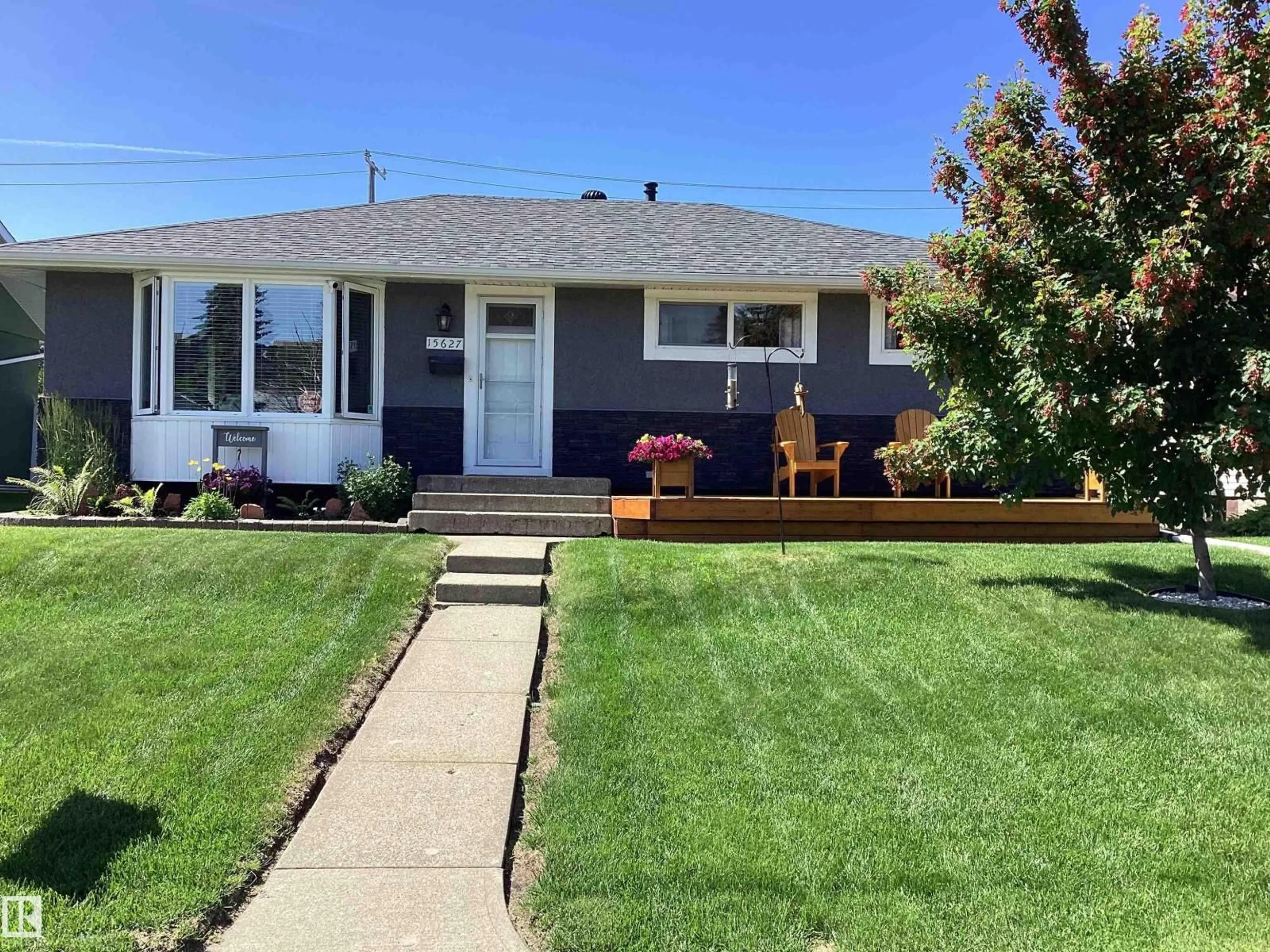 Home with vinyl exterior material, street for 15627 83 AV, Edmonton Alberta T5R3T6