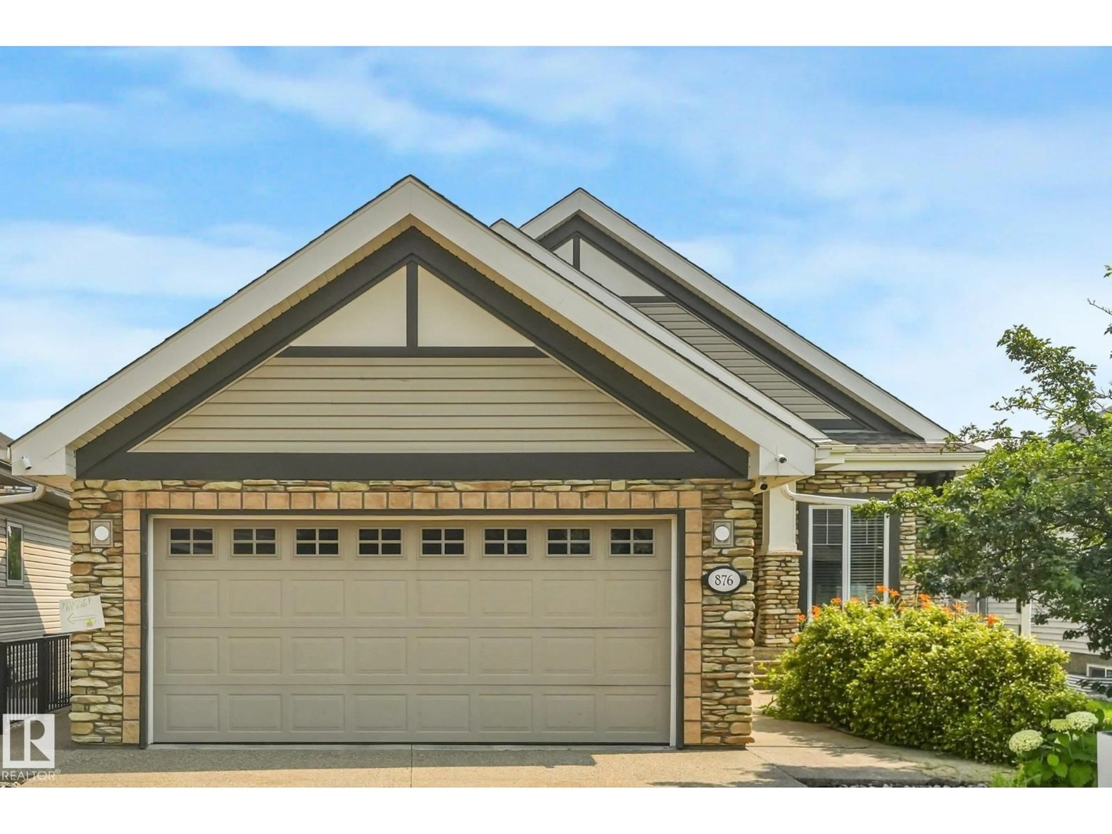 Home with vinyl exterior material, street for 876 HODGINS RD, Edmonton Alberta T6M0K8