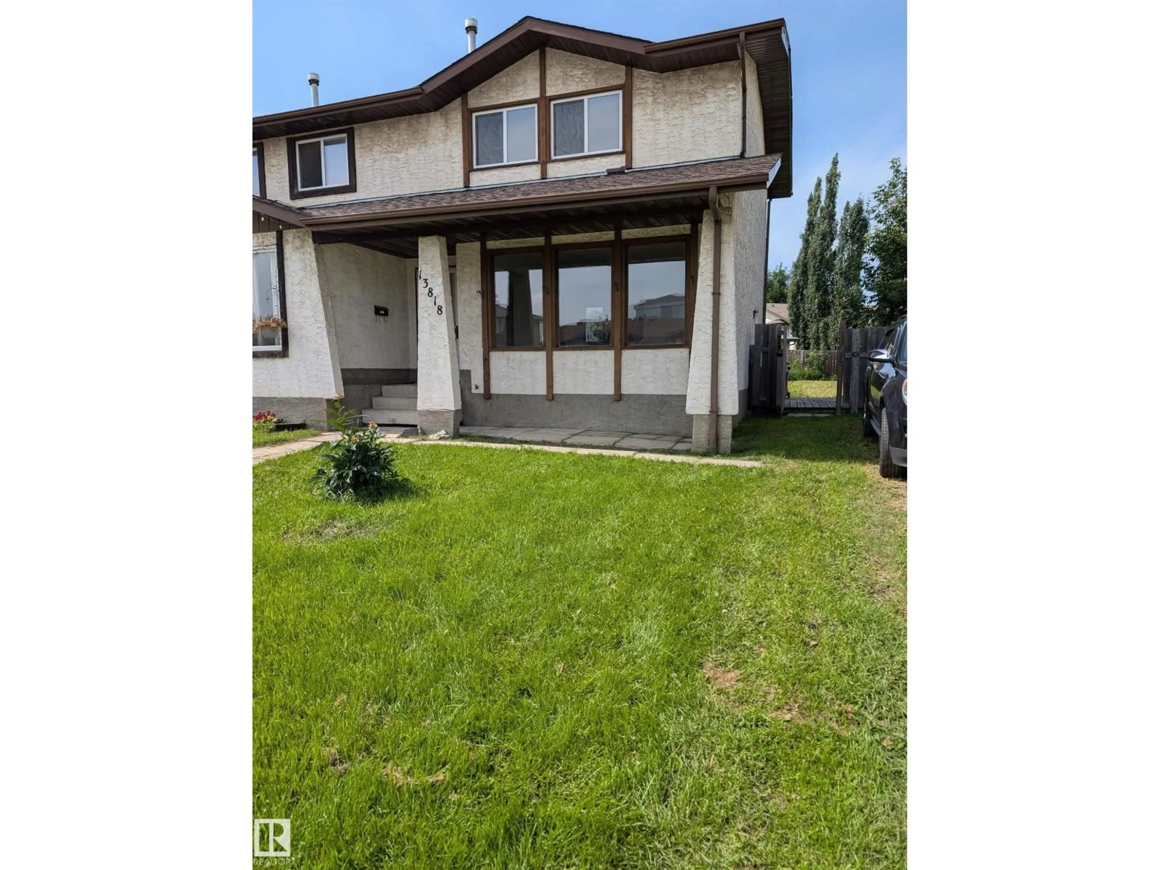 Home with vinyl exterior material, street for 13818 114 ST, Edmonton Alberta T5X4J1