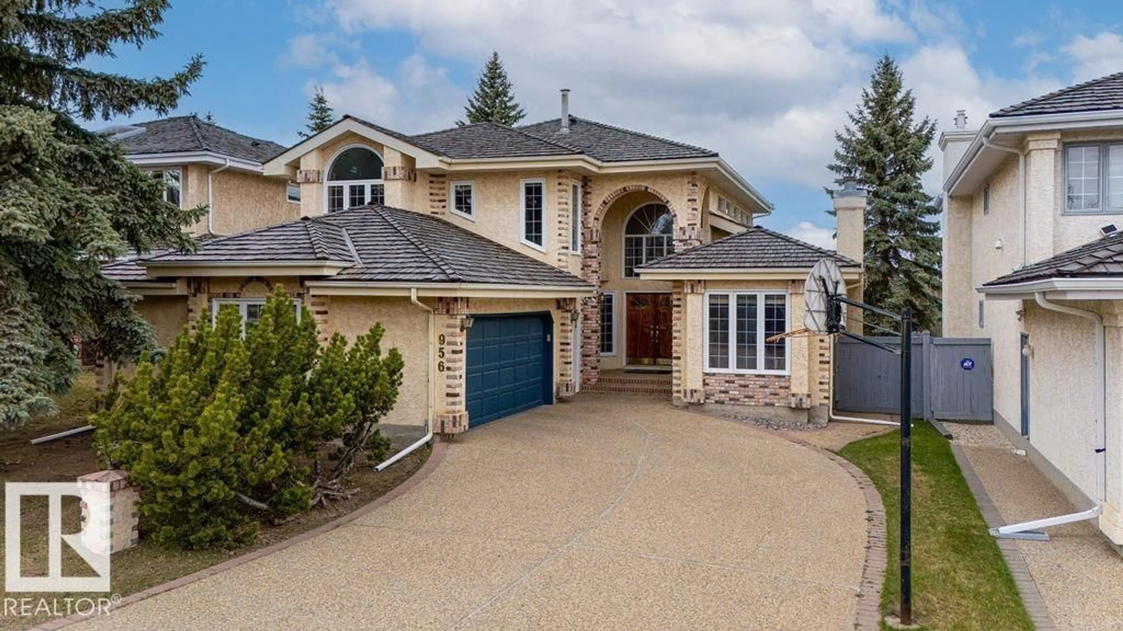 Home with vinyl exterior material, street for 956 OGILVIE BV, Edmonton Alberta T6R1K8