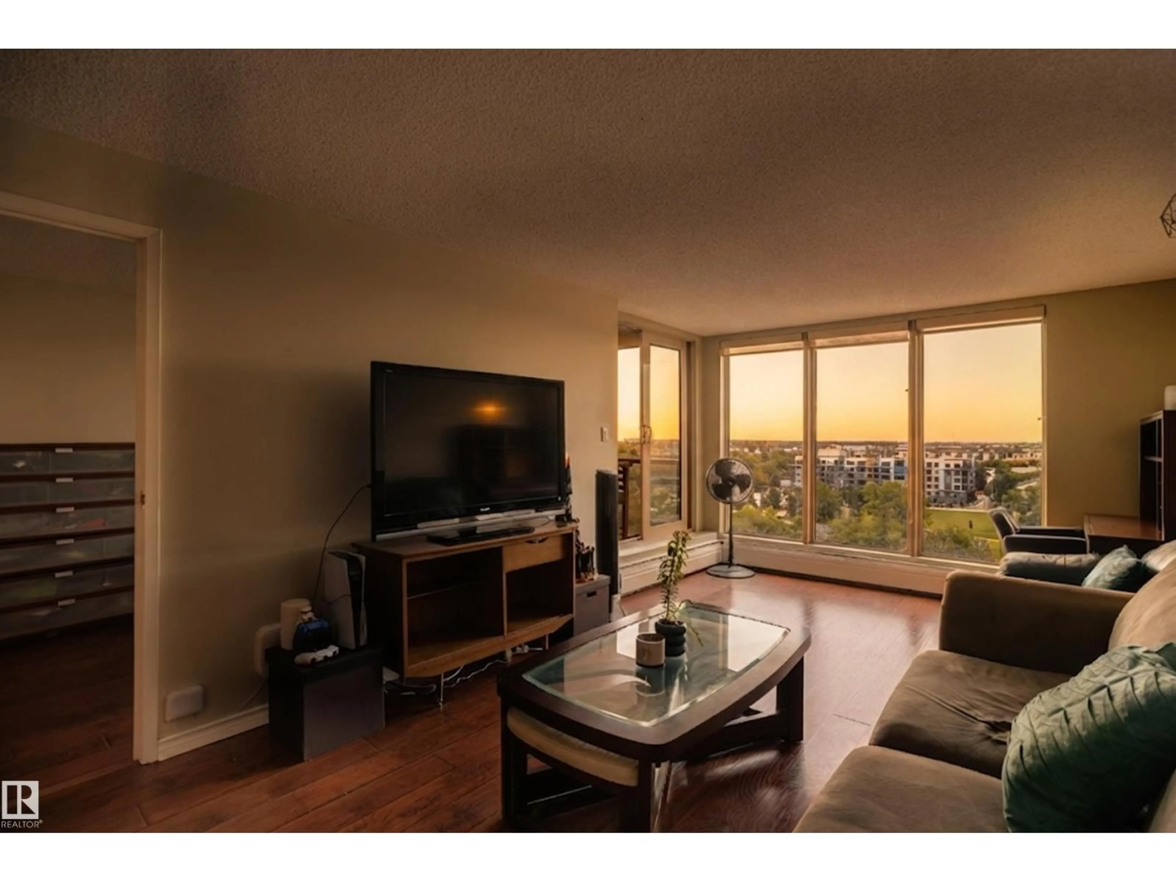 Living room with furniture, wood/laminate floor for 10149 - 1002 SASKATCHEWAN DR, Edmonton Alberta T6E6B6