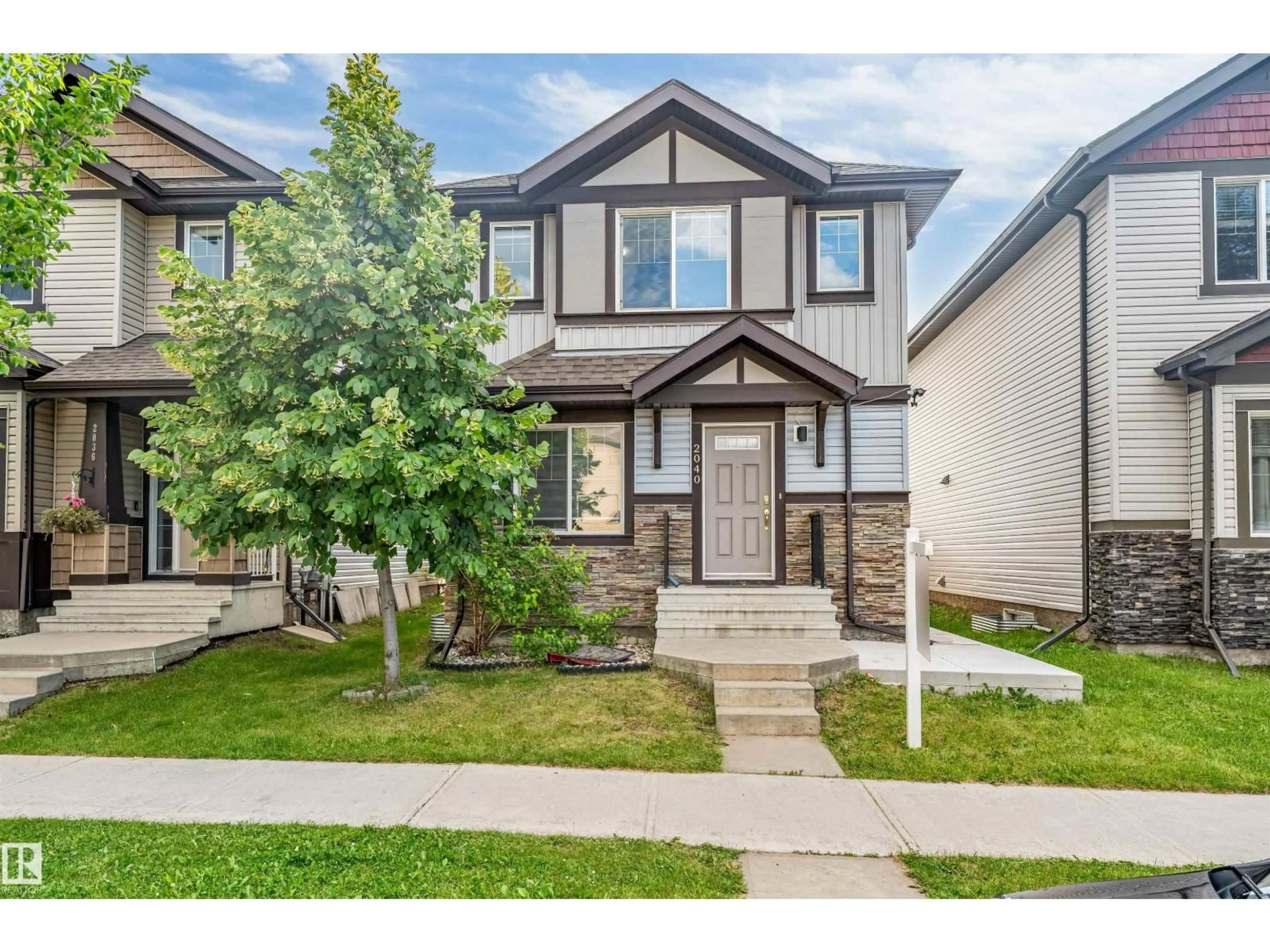 Home with vinyl exterior material, street for 2040 24 ST, Edmonton Alberta T6T0Y8