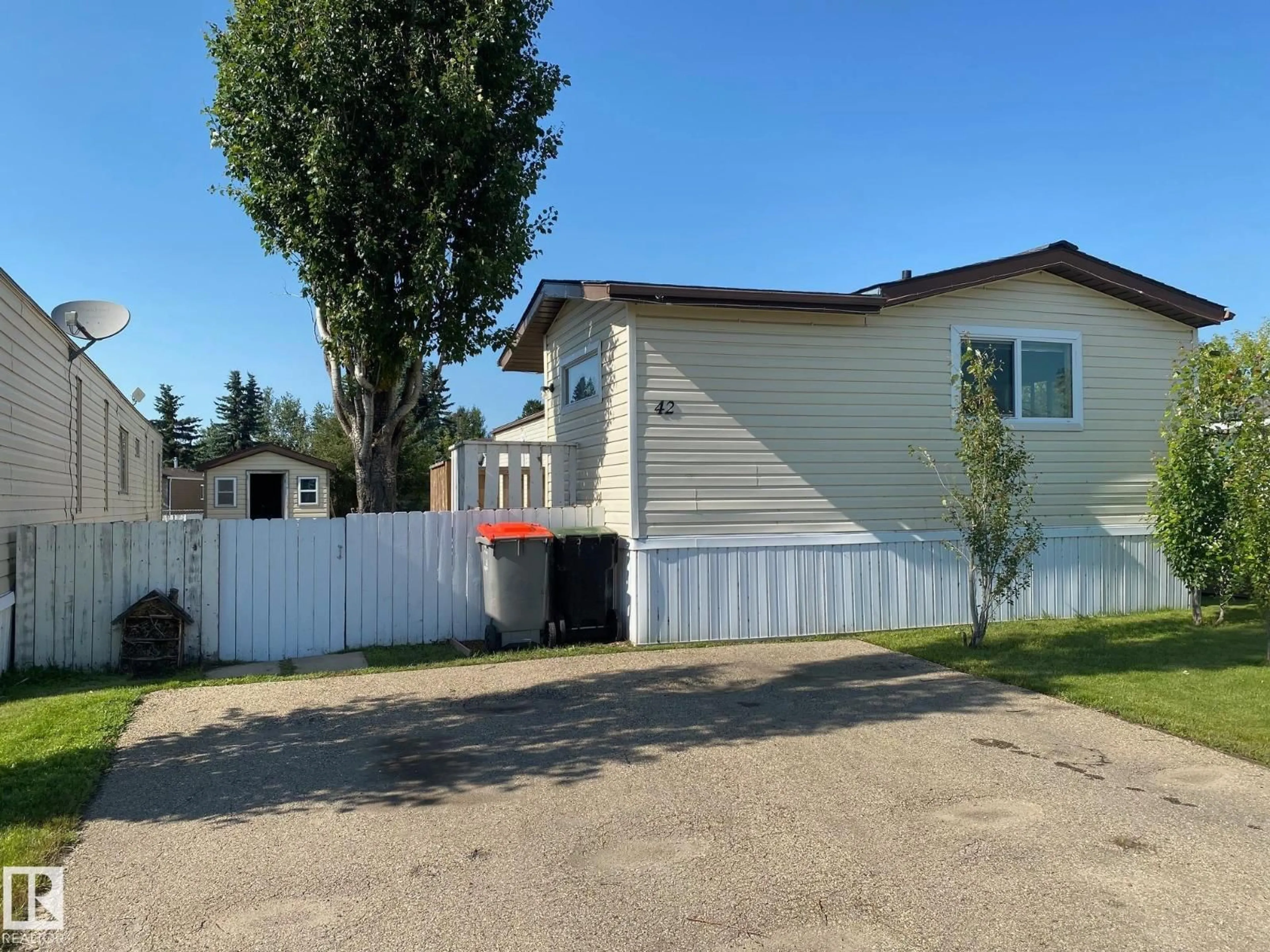 Home with vinyl exterior material, street for 042 - 4819 51 AV, Millet Alberta T0C1Z0