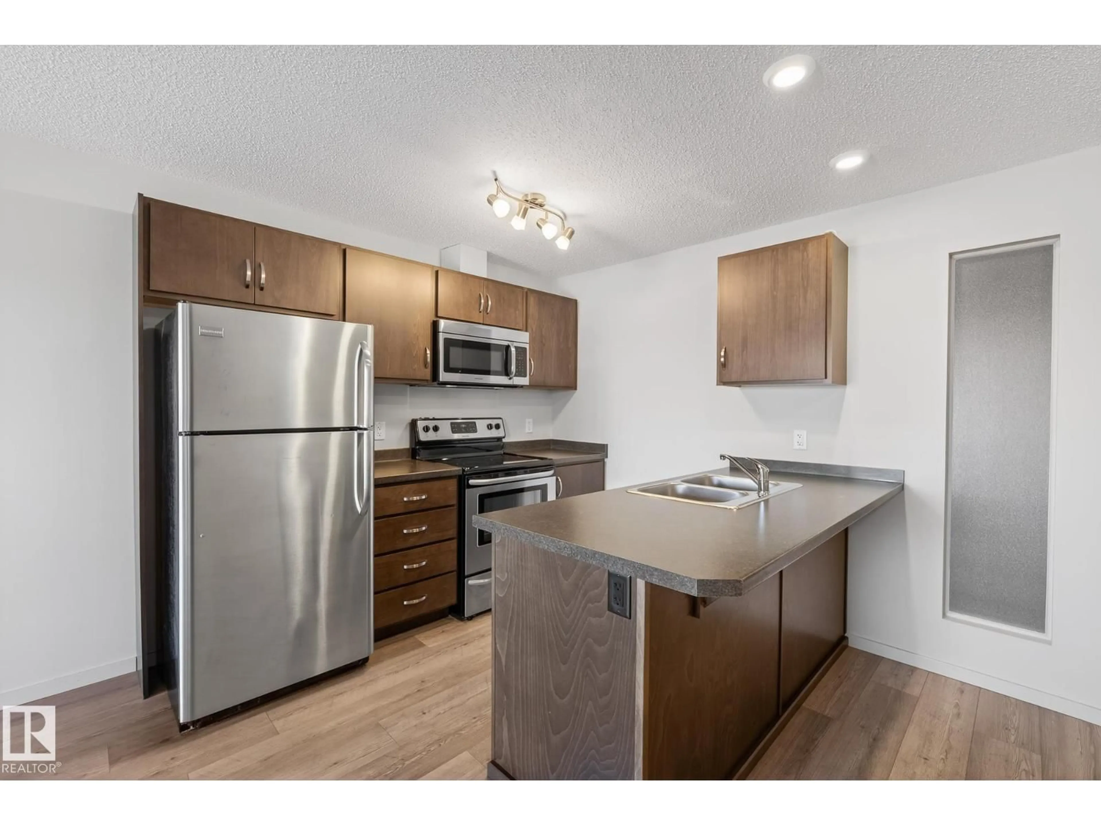 Standard kitchen, wood/laminate floor for 405 - 7711 71 ST, Edmonton Alberta T6B3J3